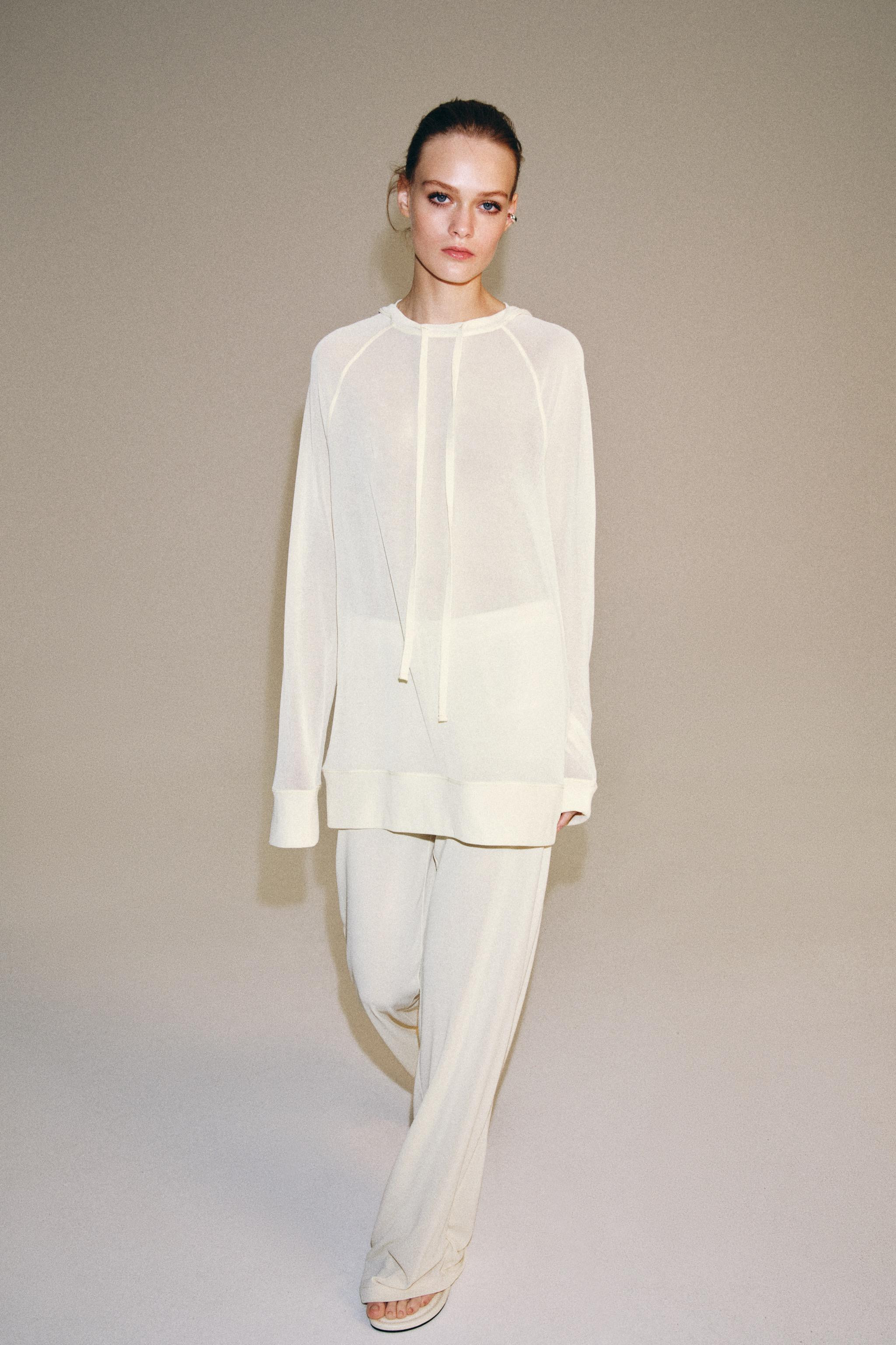Pants crafted from semi-sheer fabric. Mid-rise with adjustable drawstring waist. Interior shorts ... | Zara US