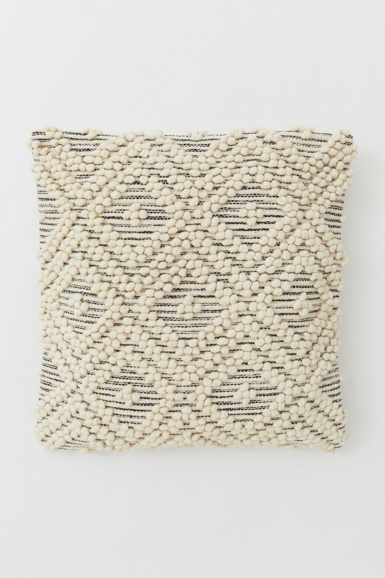 Cushion cover with front in a patterned wool blend. Solid-color back in cotton canvas. Concealed ... | H&M (US)