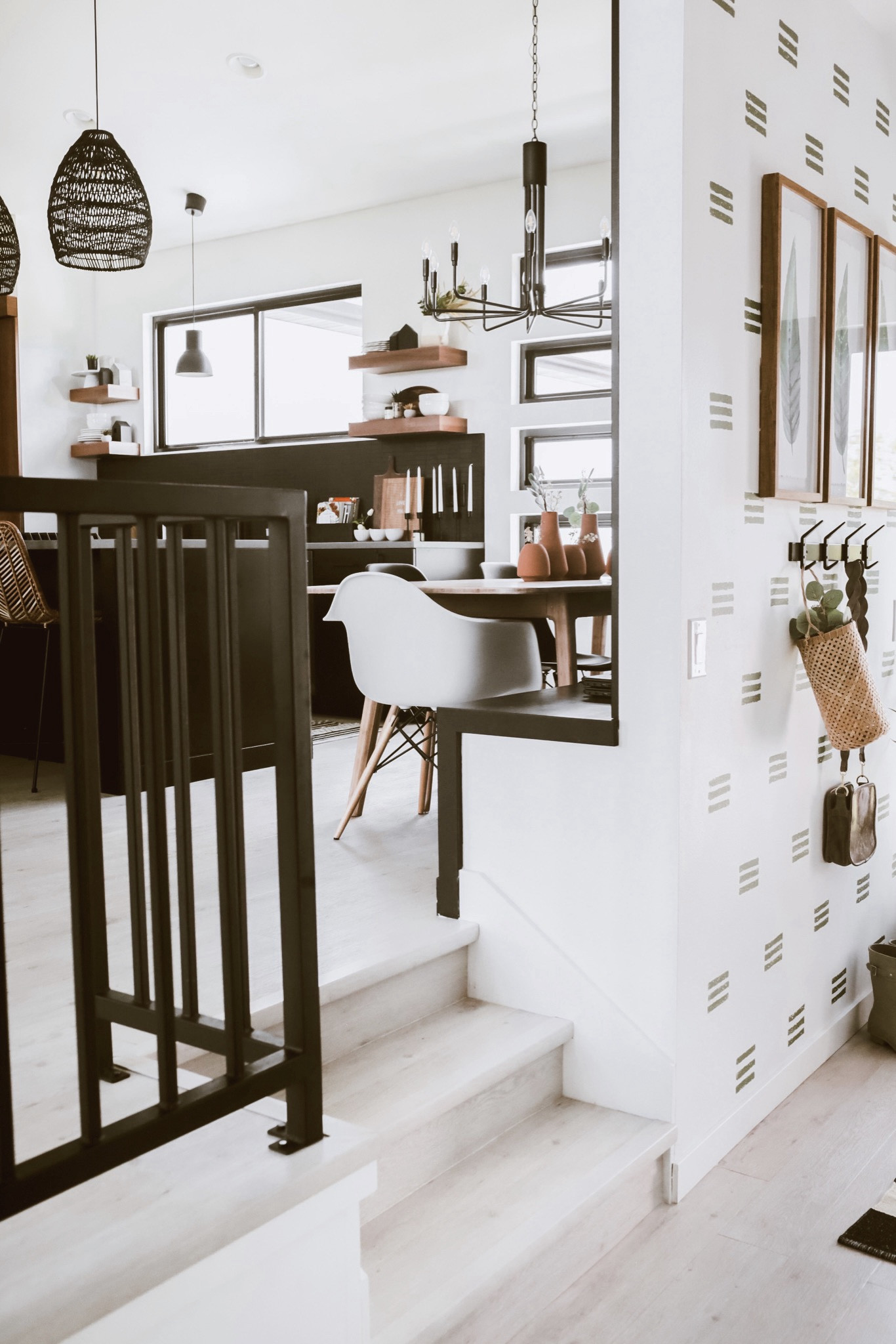 Modern home decor!  Here’s a peak of the foyer, dining area, and kitchen!  Coat rack - white dining chair - black woven light pendant - dining room chandelier - Scandinavian style 

#LTKhome #LTKfindsunder100 #LTKsalealert