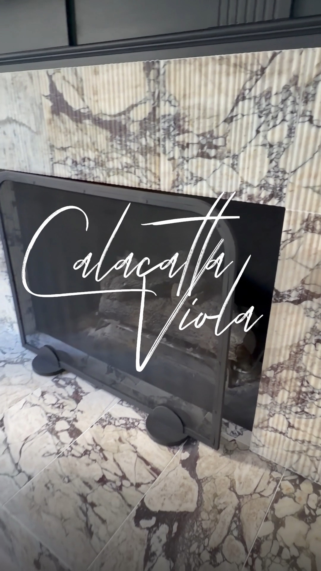 So happy with my fireplace transformation. We started by painting the surround Tricorn Black by Sherwin Williams to create depth and contrast, then added this beautiful Italian Calacatta Viola marble.  The addition of the fluted marble detailing adds bold texture, turning my fireplace into the true focal point of the living room. There’s nothing better than watching my vision come to life. 🤍🖤

#calacattamarble #calacattaviola #marble #fireplaceremodel #homedecor