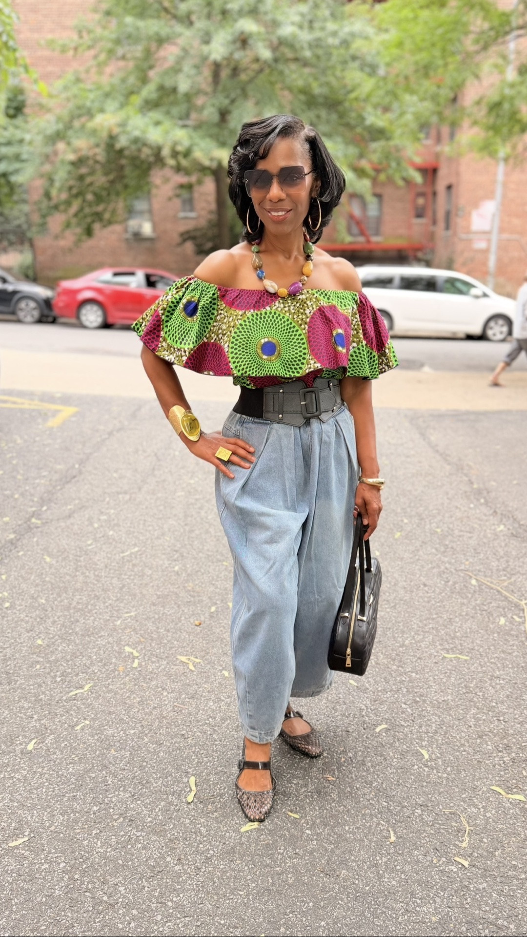 Off-shoulder Ankara top + denim harem pants — an easy throw-on-and-go combo, sis. Details below 👇

	•	Ankara off-shoulder top — Amazon, size Medium
	•	Denim harem pants — Amazon, size Medium
	•	Shoes — Steve Madden, size 9
	•	Bracelet — Amazon


#LTKover40 #LTKstyletip #ThisIs60 #FashionablyJan #StyleOver60