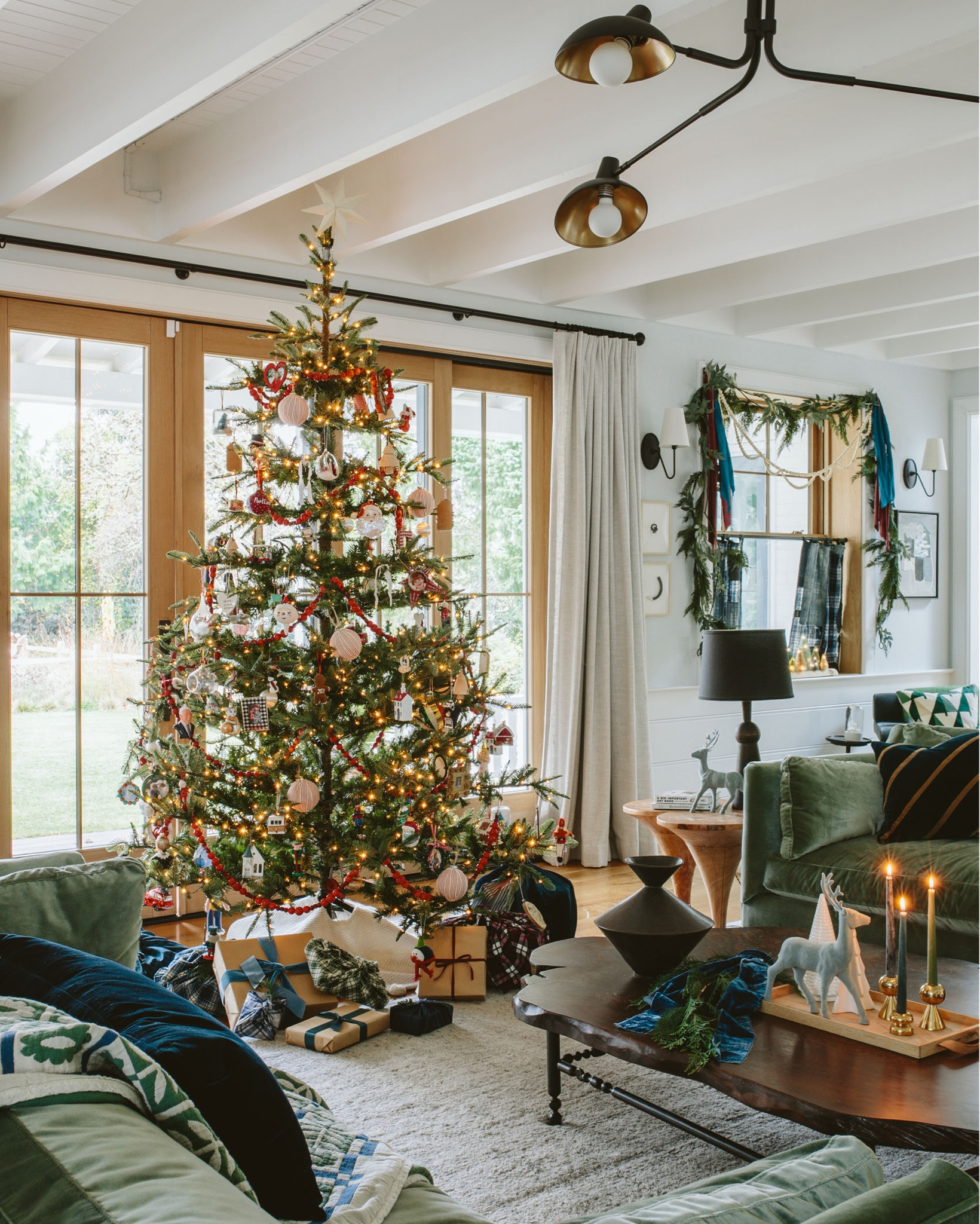 Y’all, let me be clear – if I didn’t have to decorate early (before trees are even available) I would for sure go cut down a tree in Oregon. WE LIVE IN THE LAND OF THE TREES FOR PETES SAKE. We are likely going to do this as well, for a small tree on our front porch for the experience, btw. But since that isn’t my reality and any real tree would die really early, I am so happy to say that I finally found THE BEST FAUX TREE EVER. Brian hates the trendy sparse tree, which I get. But our full perfectly triangular tree last year was not my favorite. So I ordered this one (paid full price, FYI) and it’s perfect for our home, has enough branches to hold all of our ornaments and garland and has the perfect glowy light (not too cold). We decorated it with all our family memory ornaments, some linen balls I bought last year, and I love that red wooden bead garland that I bought from Target. And yes, I’m still using the fabric instead of traditional wrapping paper for gifts so I went and bought a bunch of pretty velvets, linen, flannel plaids, and faux taffetas that I’ll use year after year, in addition to craft paper (which is cheap and recyclable).

#LTKHoliday #LTKCyberWeek #LTKhome