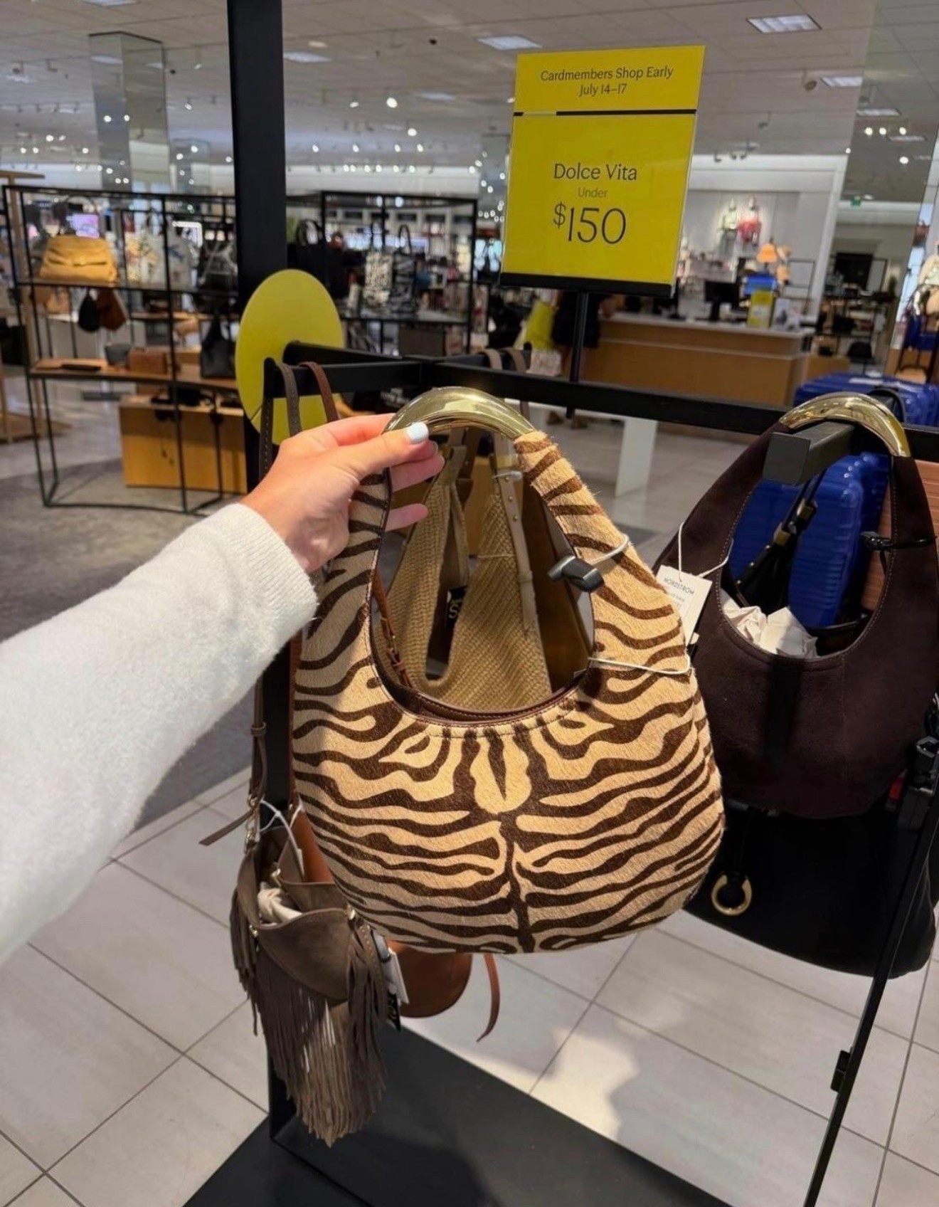 If you’re looking to add a fun accessory to your wardrobe, this zebra print shoulder bag is such a good pick. The shape feels modern while the print adds just enough personality to any neutral outfit. It’s one of my favorite statement bags from the Nordstrom Anniversary Sale.

#LTKootd