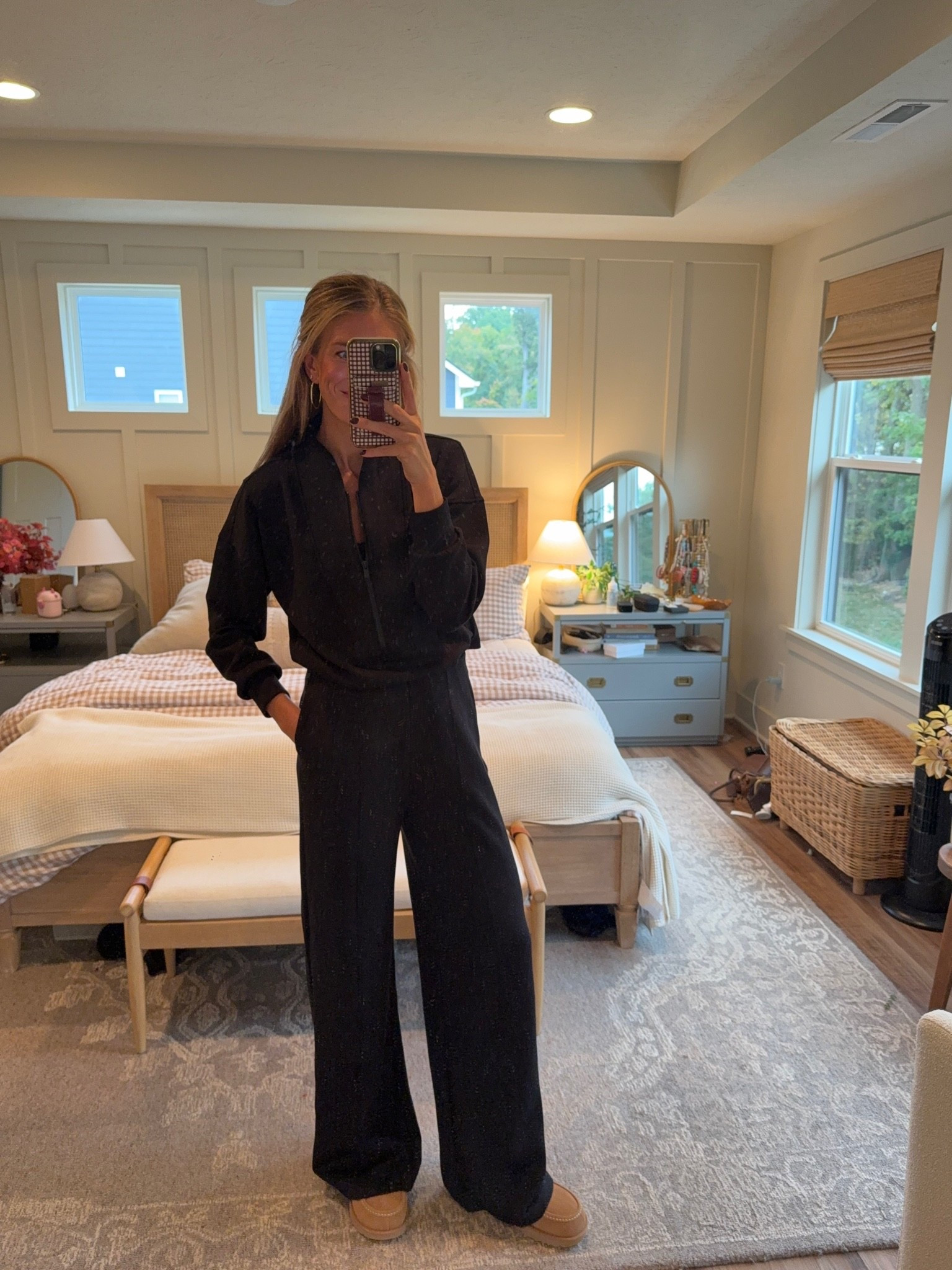 I am in love with this Spanx jumpsuit. It is tall girl, friendly. I am wearing size small tall. It is made of the softest material and you can pull down the back to go to the restroom without having to takeoff the entire jumpsuit.
