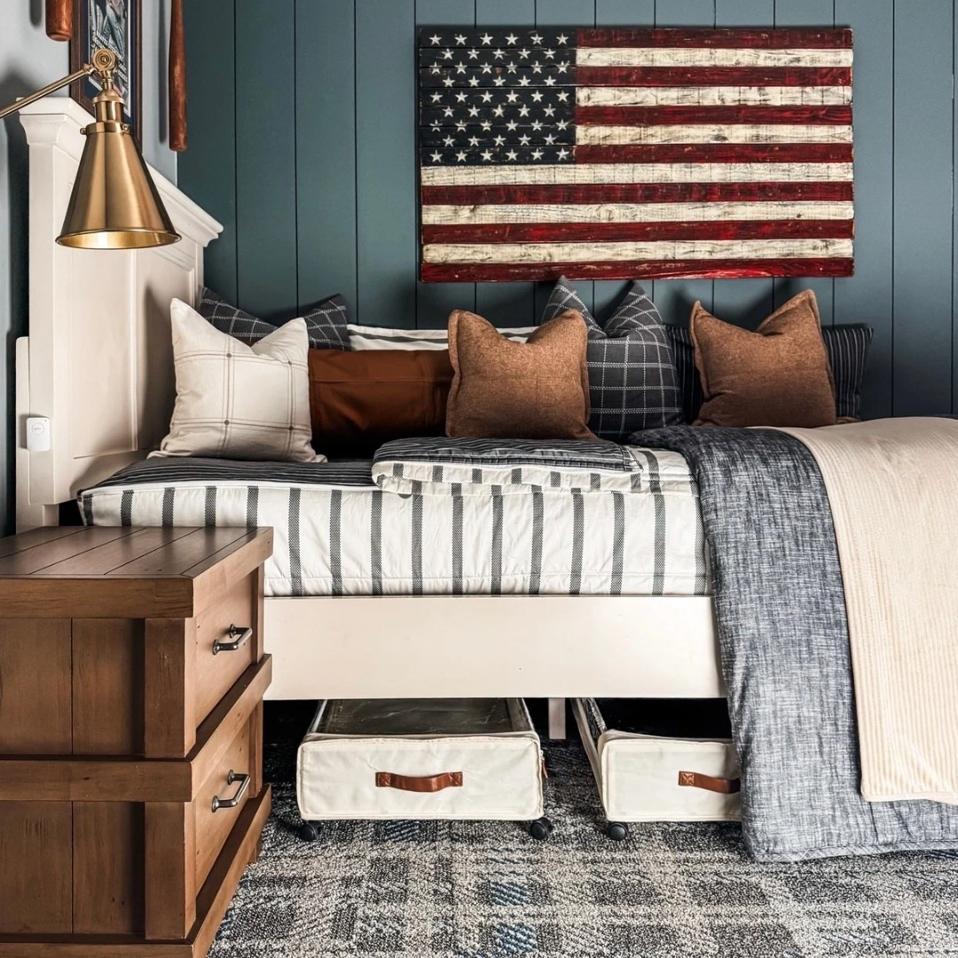 A cozy, all-American bedroom moment 🇺🇸🤎
Loving the mix of striped bedding, plaid throw pillows, and warm earth-tone accents. The wood nightstand adds a rustic touch, while the brass wall sconce brings in a little modern shine. And let’s not overlook the under-bed storage bins with leather pulls — perfect for keeping things neat and out of sight!

Tap to shop this patriotic bedroom look and my go-to organization picks!

Bedding by Beddy’s
Code EANES = 20% off 

Bedding Details: 
Chandler Beddy’s (Twin, Cotton, ZipBase)
Taylor Luxe Blanket 
On-the-go blanket tan grid 
Owen Luxe Leather XL Lumbar Pillow Cover
Lincoln Medium Pillow Cover
Monroe Medium Pillow Cover 
Lucas Euro Pillow Cover


#eanesinteriors #americanflagdecor #stripedbedding #plaidpillows #brasssconce #woodnightstand #underbedstorage #leatherpulls #cozybedroom #organizedliving #bedroominspo #patrioticdecor #ltkhome #ltkbedroom #rusticmodern #collectedstyle #beddinggoals


#LTKHome #LTKStyleTip #LTKFindsUnder100
