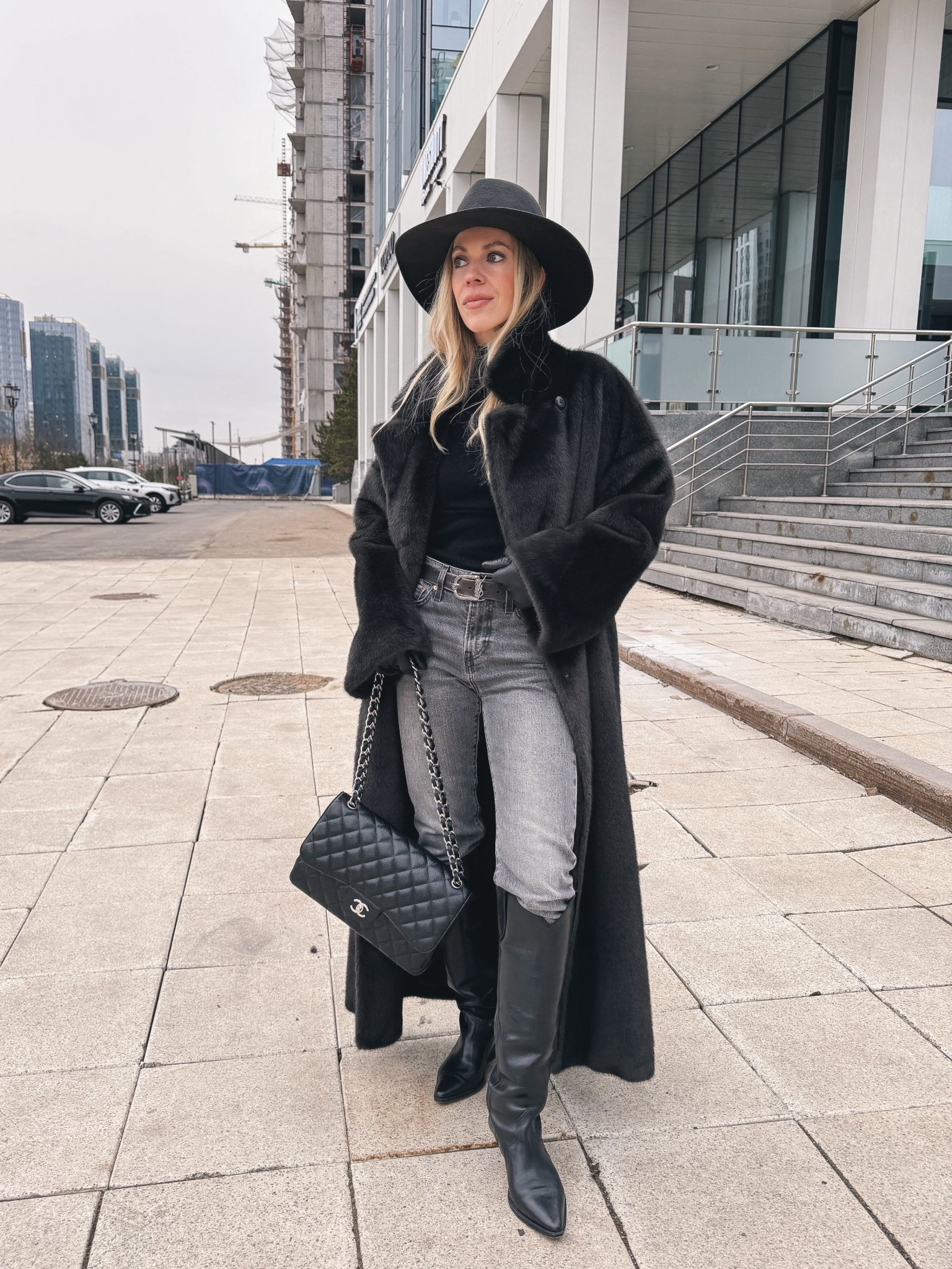 Gray faux fur coat, gray and black winter outfit, Levi’s gray slim leg jeans, skinny jeans with tall boots, black western boots

#LTKOver40 #LTKSeasonal #LTKFindsUnder100