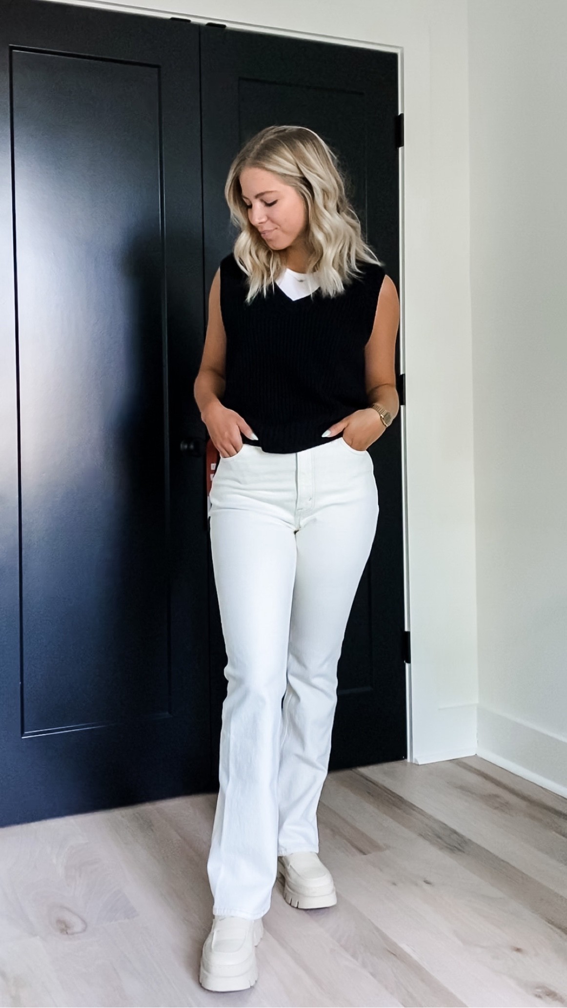 Black sweater vest with white/ cream straight leg Abercrombie jeans and Steve Madden lug sole moccasins 

#LTKstyletip #LTKworkwear #LTKshoecrush