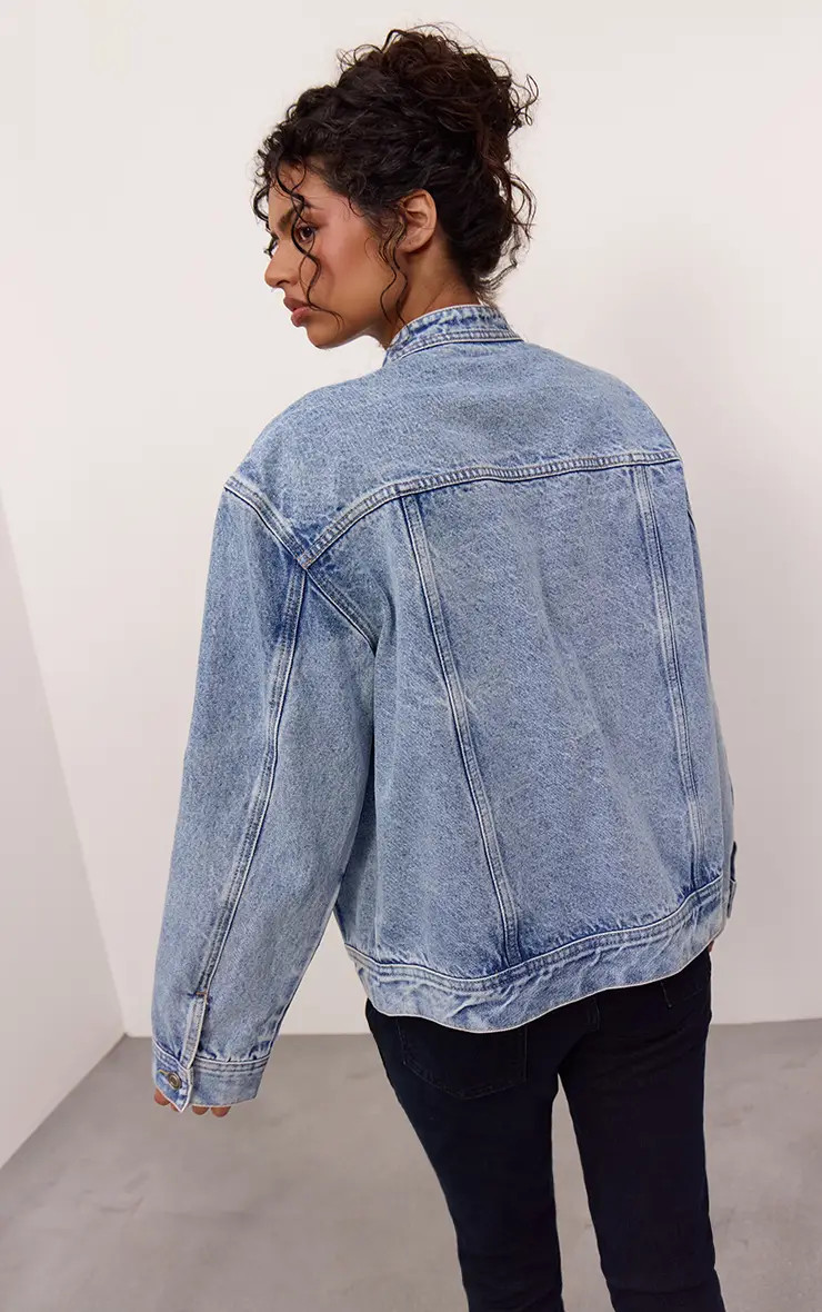 Mid Blue Asymmetric Button Down Denim Jacket | PrettyLittleThing US