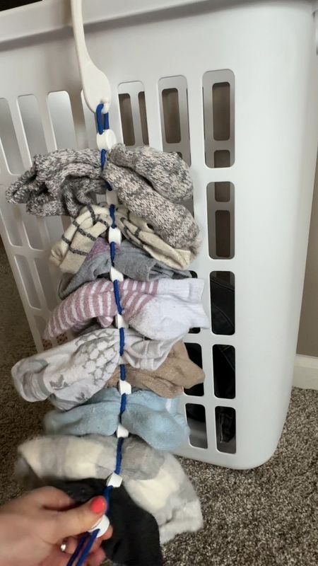 If the dreaded sock pile is an issue in your house, like it is mine and you can never find a matching one, try the sock dock! It’s absolutely GENIUS!!! 
You simply hang it on a laundry hamper and instead of throwing your socks in with your clothes, you attach them pair by pair. 
It comes in a pack of two in each sock doc holds nine pairs, and they adjust to fit thick or thin socks. 
Drop them in the wash, then, when you take them out of the dryer they are clean and all still together!!! GENIUS!!! 
Then just hang them in your closet or on a closet door and your socks are in pairs ready to be worn!

#LTKfamily #LTKkids #LTKhome