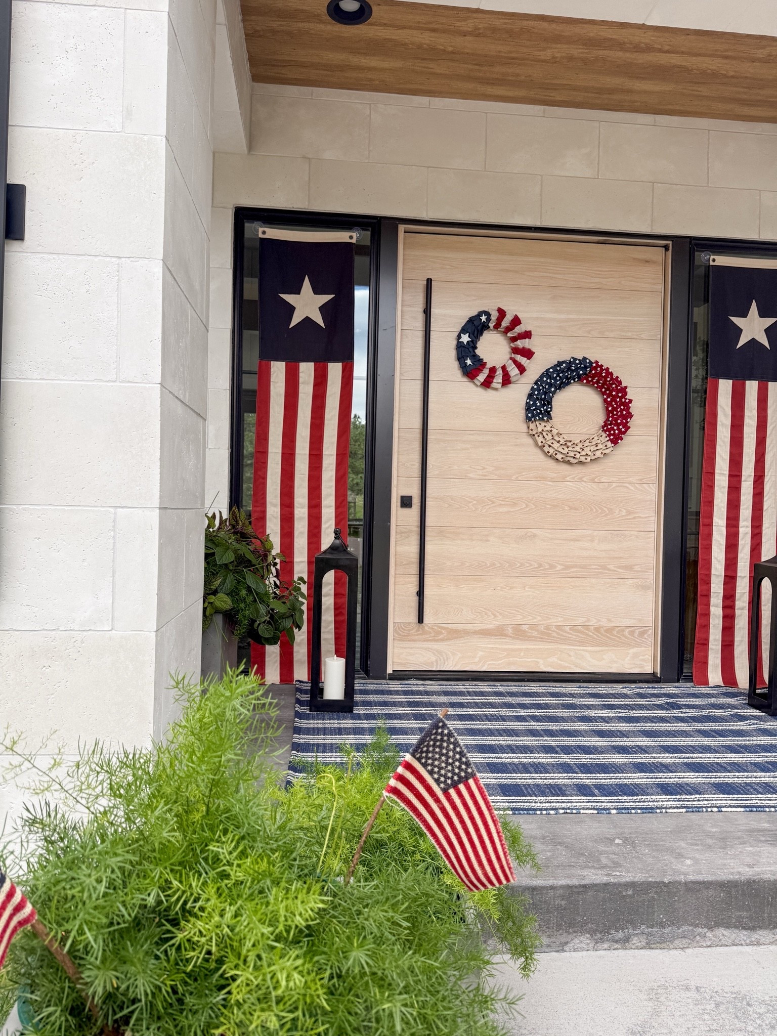 Fourth of July front porch. Love the Heritage Banner Flags! So easy to hang with suction cup hooks. I added a double wreath to the front door this year. So cute!

#LTKdayinmylife #LTKSeasonal #LTKHome