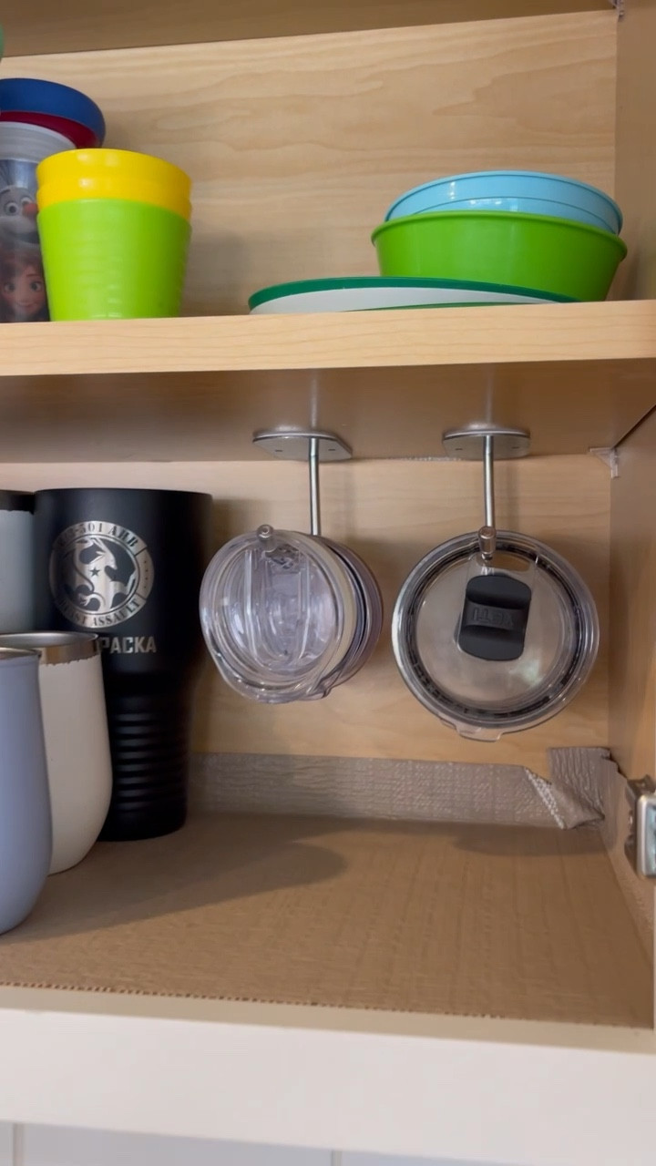 The tumbler lid organizer you need in your life! They fit stanley cup lids, yeti mug lids, and more! I got the 2 organizer pack but 1 organizer option is available. They are self adhesive or you can drill them into your cabinets with hardware that is included. Such a great Amazon find!
#kitchenorganizer #kitchenmusthave #kitchenorganization 

#LTKVideo #LTKhome #LTKfindsunder50