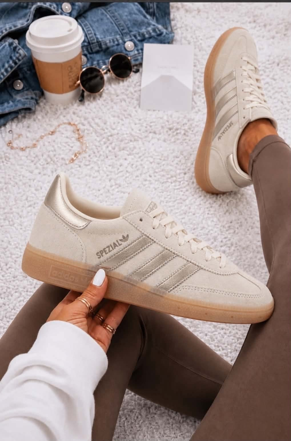Adidas dropped the Handball Spezial in this gorgeous cream and gold color combo!! These are the shoes to get if your loving the gold/silver trend this season but do not want a full gold statement shoe. This is a cute baby step way to wear the pop of gold on your sneakers this Fall.

#LTKootd #LTKdayinmylife #LTKgrwm