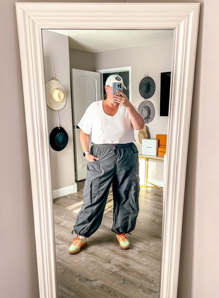 A casual but cute dinner outfit idea. These baggy for wide leg cargo pants with a tie on the ankle are so versatile. They can be worn wide leg or cinched up like I have them here. I styled with my colorful platform sneakers and a bodysuit under a waffle knit crop top. 

Plus size summer outfit 
Plus size outfit ideas
Size 18
Size 20
Plus size outfits
Psootd 
Cargo pants outfit 

#LTKStyleTip #LTKOver40 #LTKPlusSize