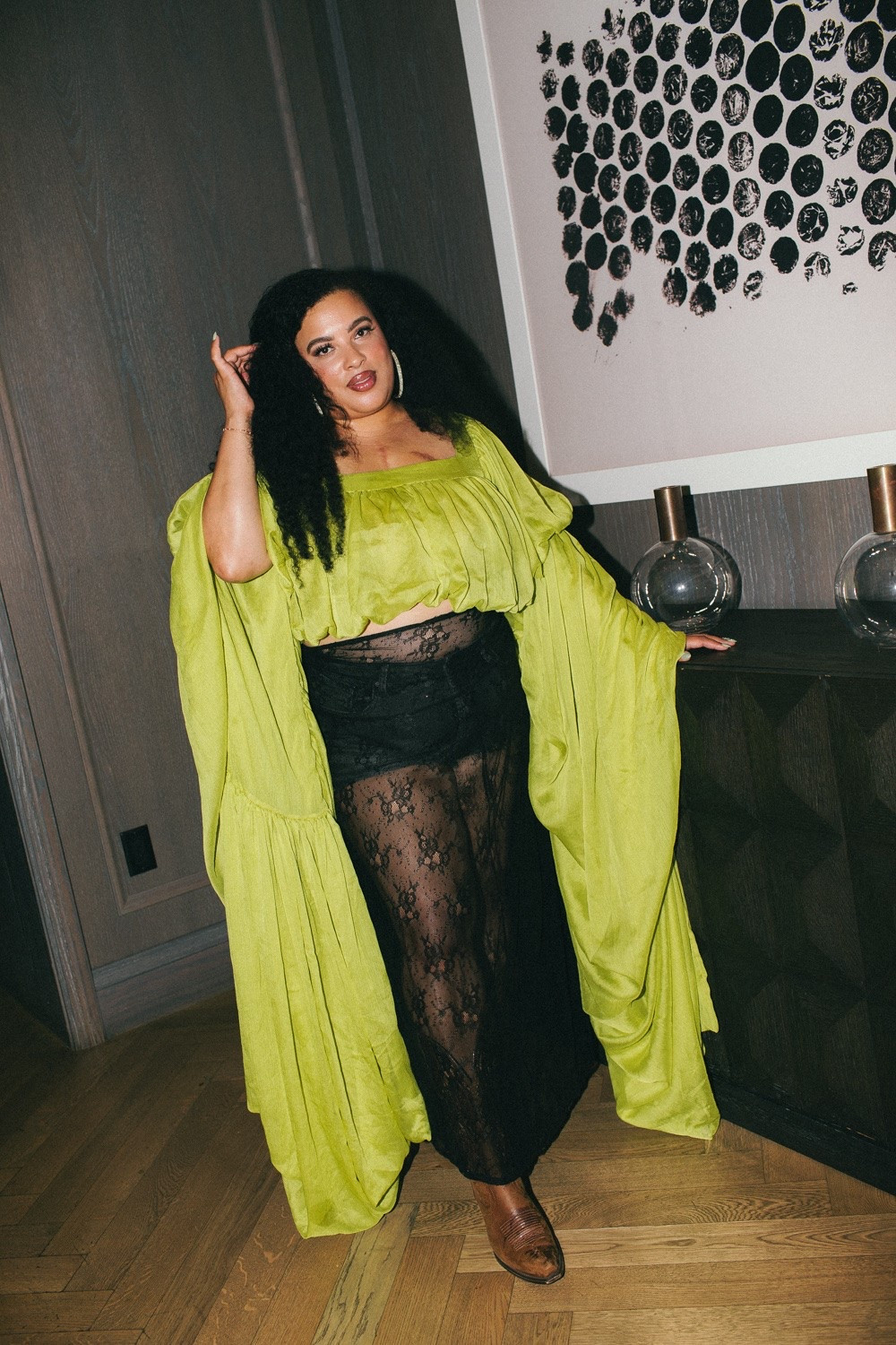 Bringing the ultimate drama for a chic night out! I am absolutely obsessed with this vibrant lime green crop top featuring show-stopping, oversized statement sleeves. Styling it with a sheer black lace maxi skirt over matching shorts creates the perfect balance of edgy, bold, and high-fashion style. 💚

Grounding the look with classic brown boots and elegant silver hoops for an unexpected, textured twist. This outfit is all about making a confident statement and turning heads wherever the night takes you! ✨

#nightoutstyle #boldfashion #statementlook #lace skirt #chicstyle #glamoutfit #ootdinspo

#LTKootd