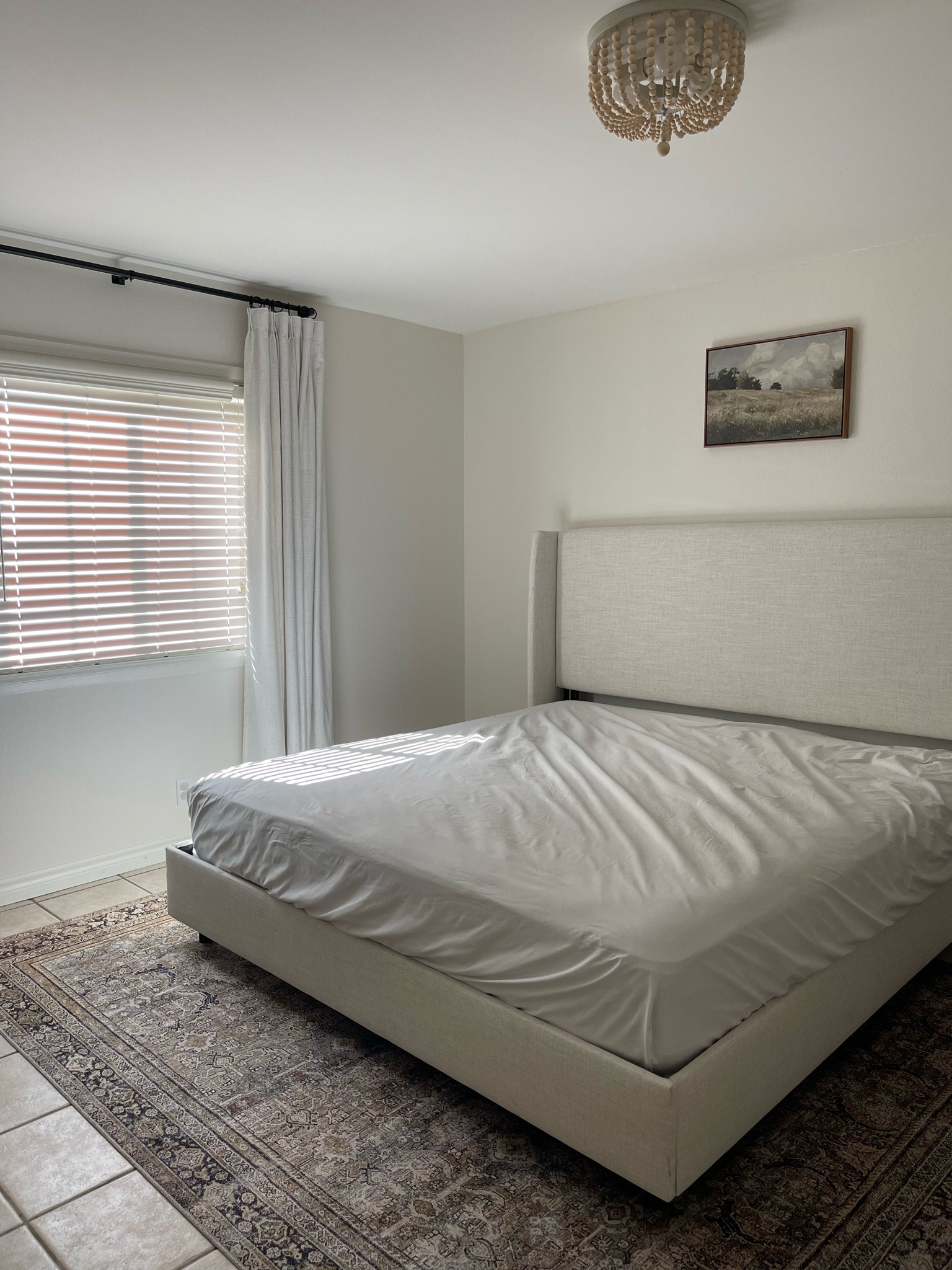 Our Master Bedroom! Bed frame is in the color Linen Talc, king size bed. Rug is the “7.6x9.6” option. Photo above bed is 16x24 option. Curtains you will need to order 2 to get some on either side! We have 8 ft. ceilings and did the 52w90L in. length in beige white. Hung the curtains 2 in. below ceilings (8 ft. ceilings) and 12 in. out from either side of window  

#LTKhome