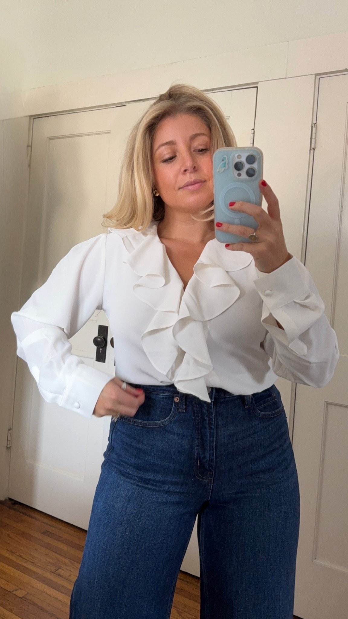 White rufflw long sleeve top - SO BEAUTIFUL and TIMELESS

Runs a little small and would suggest sizing up for your bust! For Reference: I sized up from my normal size small to a medium 

#LTKMidsize #LTKmomlife #LTKPetite