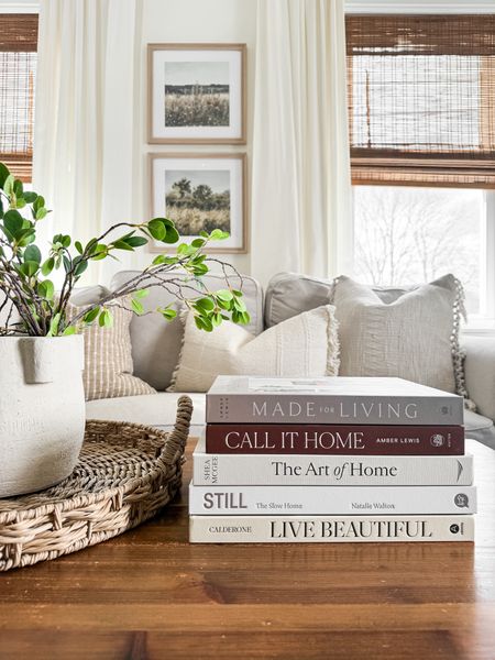 Neutral coffee table books. Living room decor. Spring stems. 

#LTKhome #LTKstyletip #LTKSeasonal