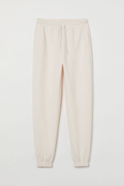 Sweatpant joggers in soft fabric. High waist, drawstring waistband with smocked elastic, and side... | H&M (US + CA)