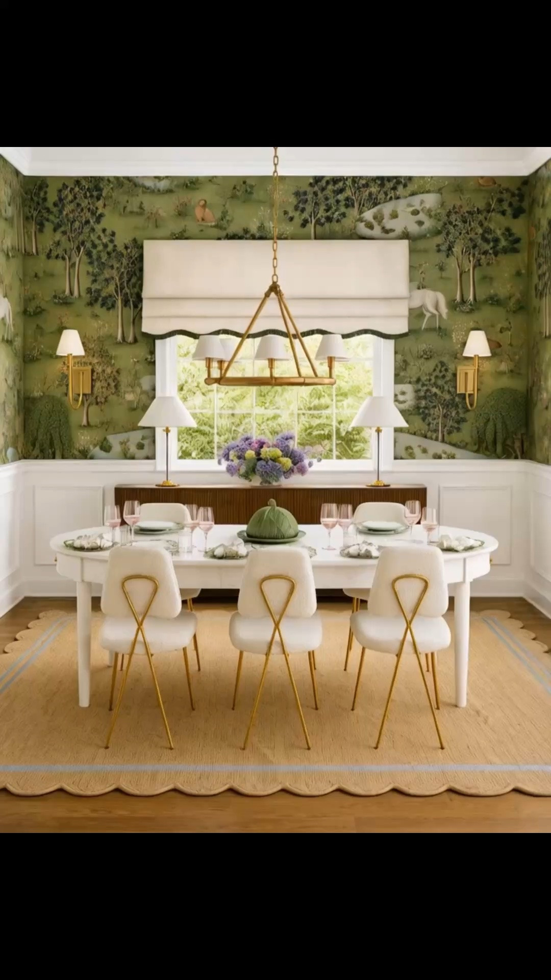 Elegant coastal chic, layered with contrast, natural texture, and a strong sense of story.

The lush jungle wallpaper brings the room to life with color, movement, and drama, while the Serena & Lily Beach House Expandable Dining Table keeps the space feeling light and refined with its creamy finish and softly rounded silhouette. A woven rattan rug adds relaxed coastal texture, while the dining chairs introduce a slimmer, sexier contrast through their delicate lines and X-shaped brass detailing.

The timeless chandelier anchors the room beautifully, complemented by the wall sconces and buffet lamps for a polished, layered glow. Finished with the sideboard, pink glassware, a fresh floral arrangement, and an elegant dinner set, the entire room feels bold, collected, and effortlessly sophisticated.#CoastalChic #ElegantDiningRoom #DiningRoomDesign #SerenaAndLily #BeachHouseDiningTable #ExpandableDiningTable #CreamDiningTable #JungleWallpaper #Wallpaper #RattanRug #DiningChair #BrassDetail #Chandelier #WallSconce #BuffetLamp #Sideboard #RomanShade #PinkGlassware #FloralArrangement #DinnerSet #ModernClassic

#LTKHome #LTKdayinmylife #LTKHome #LTKSaleAlert