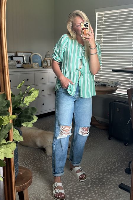 Summer Jeans Outfit ✨

Jeans - 28 - these are pretty true denim with just a smidge of stretch. I feel like they fit pretty TTS but if you want more of a relaxed fit, go up one. When they are unrolled, they hit at my foot. 👖

Bow tie top - M - this is such a fun lightweight shirt for summer! I love the front tie closure and the fun pattern! 🎀

Sandals - TTS - these fit perfectly and are super cushioned on the bottom! 🙌🏼

#LTKFindsUnder50 #LTKShoeCrush #LTKSeasonal