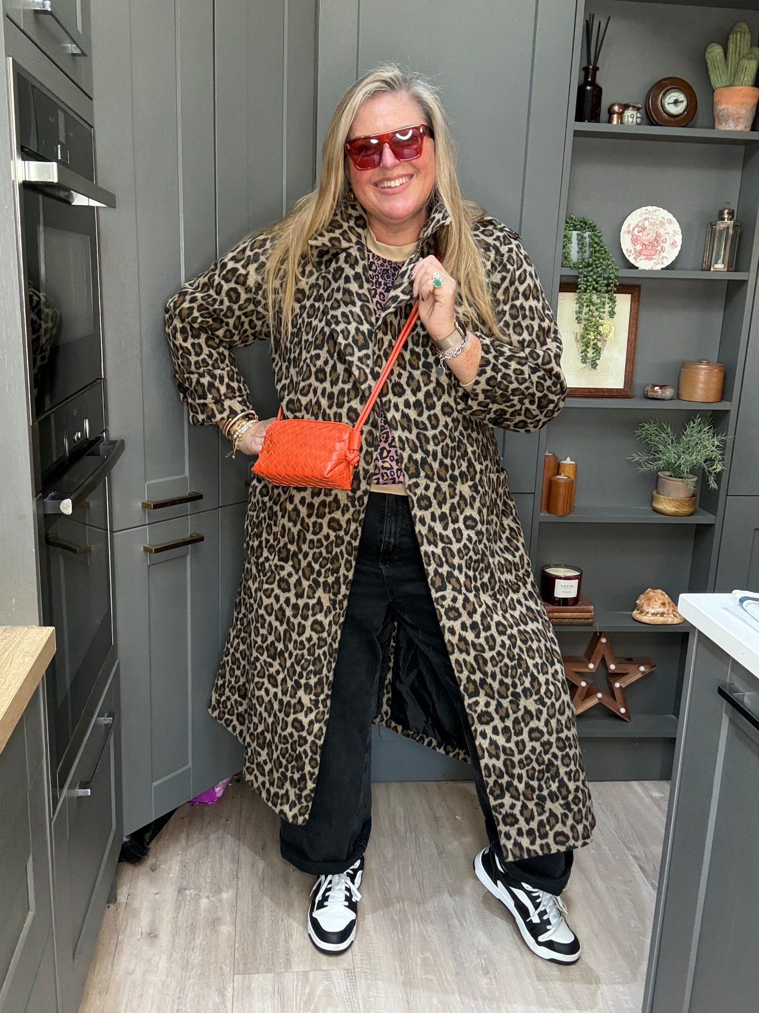 Leopard coat, black jeans, leopard sweatshirt, white tshirt, orange sunglasses, orange bag, black & white trainers 

#LTKplussize #LTKcurves #LTKjeans