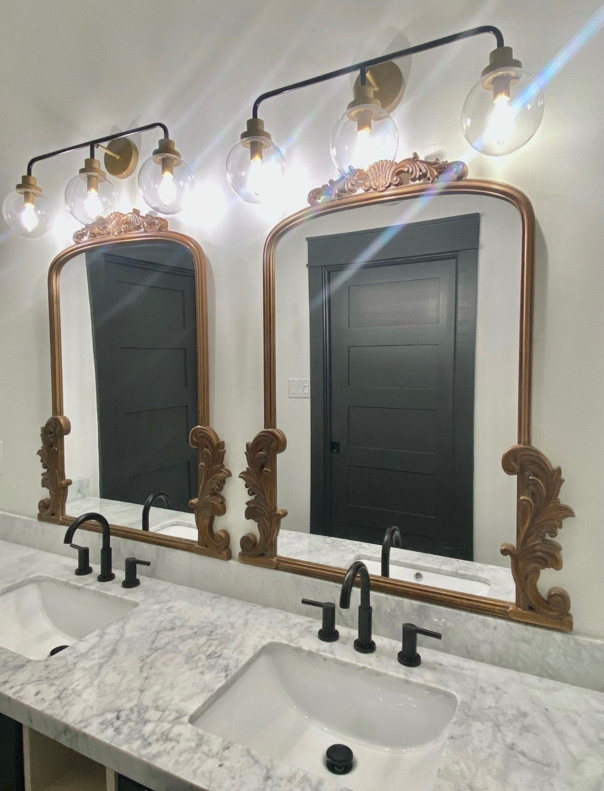 Modern Bathroom Style in Black & Gold

#mirror #vanitymirror #blackfaucet #bathroomfaucet #globevanitylight #light #scrollmirror #ornatemirror #modernbathroom #goldhardware #goldlightfixture #goldvanitylight #vanitylight #bathroominspo#LTKStyleTip #LTKFamily

#LTKHome #LTKselfcare #LTKgrwm
