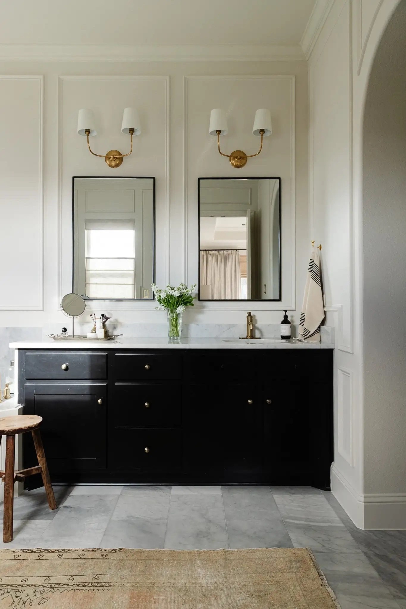 My DIY bathroom makeover 🛁 

I’m linking the trim and crown moulding I used as well as the black mirrors, brass double sconces (and a look-for-less), brass single hole faucet, striped towels, hand soap pump, vintage stool, and a similar
vintage Oushak rug

#LTKHome