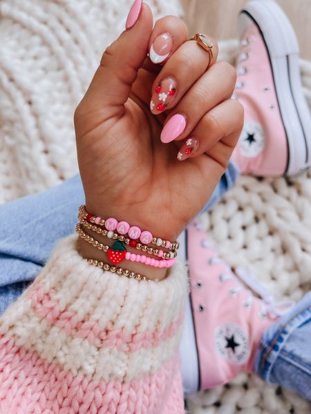 Strawberry gold bracelet stack // mama bracelet // pink converse // platform converse 

#LTKfindsunder50 #LTKshoecrush #LTKstyletip