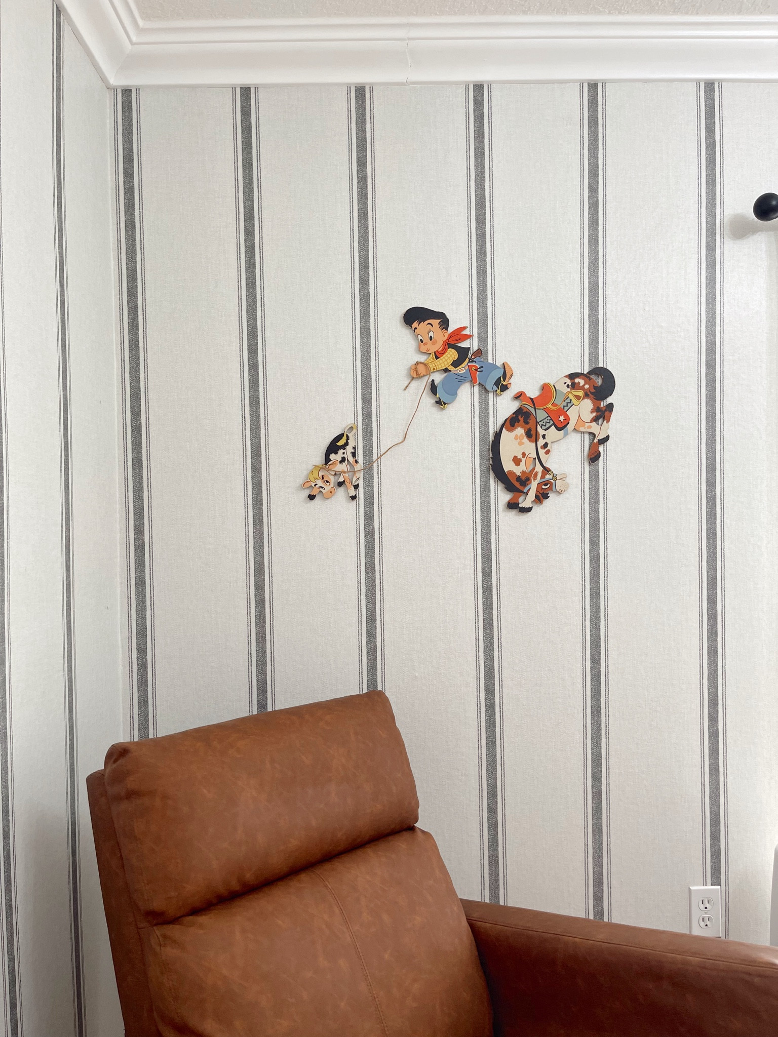 Vintage cowboy touches in baby boy’s nursery! Peel and stick striped wallpaper from Amazon was super easy to apply and a damage free and more affordable option. We love our saddle colored leather rocking chair from Amazon as well that works amazing and is budget friendly. The vintage cowboy wall decor decals are available on etsy and linked as well!

#LTKHome #LTKBaby #LTKFindsUnder50