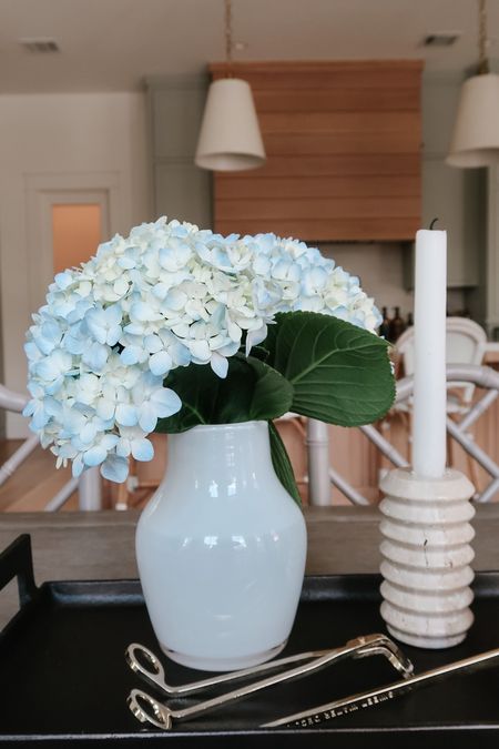 A very simple way to style a dining table is just with a vase of fresh flowers. Here, I put them on a tray with candles, candle snuffers and marble coasters.



#LTKstyletip #LTKhome #LTKfindsunder50