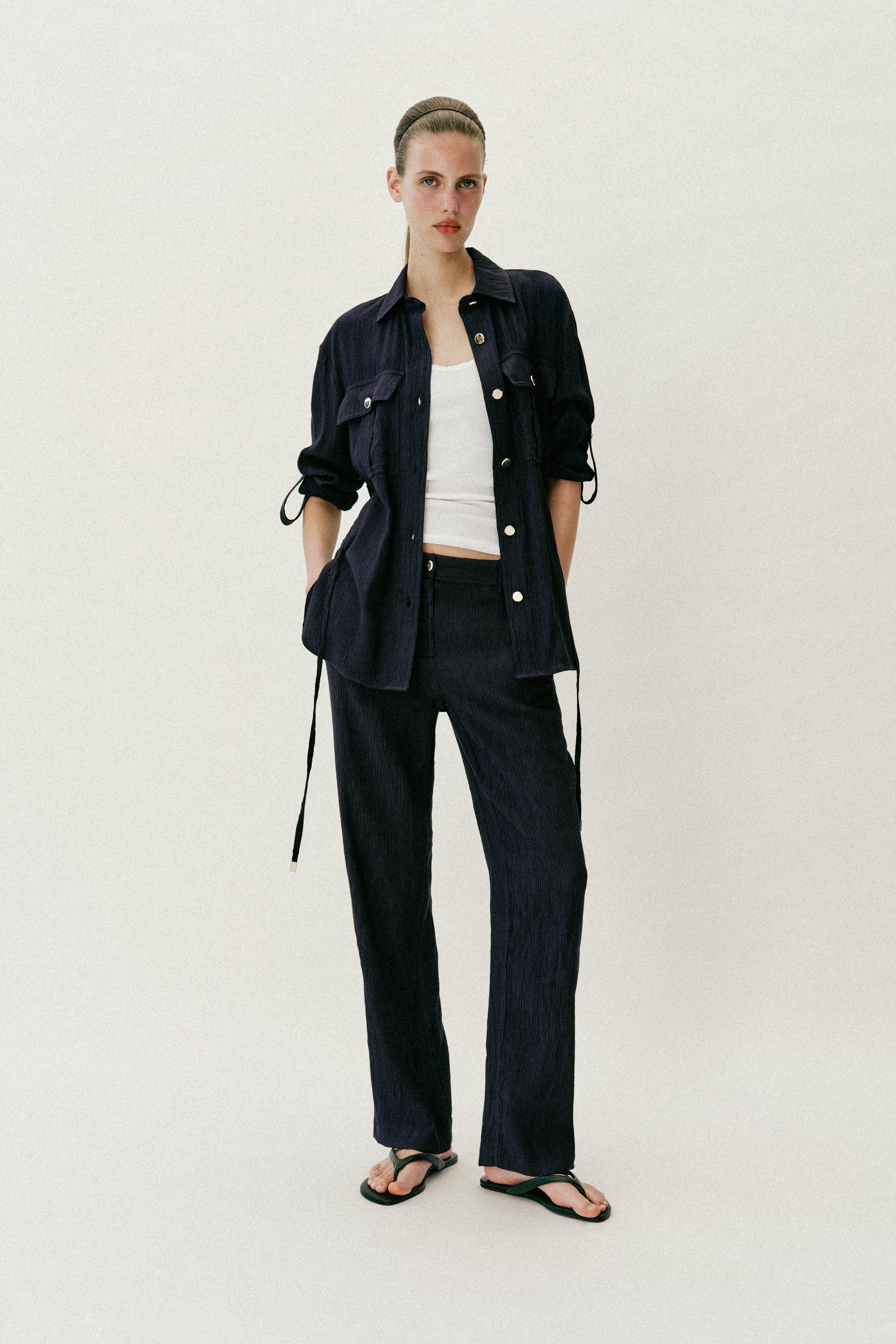 Mid-rise pants with front pockets and faux back welt pockets. Straight leg. Front zip and button ... | Zara US