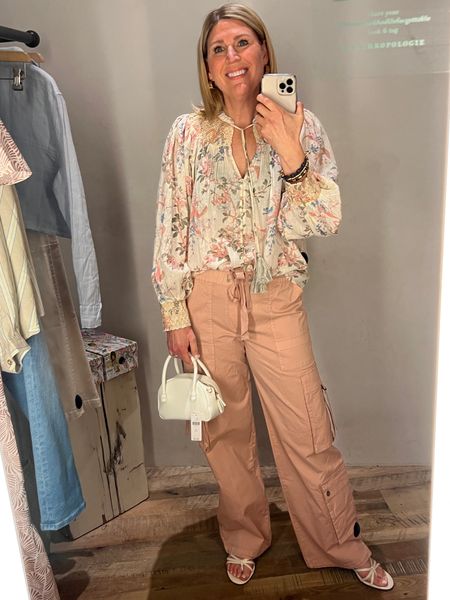 Cargo pants run oversized! Also cinch them at the ankle so they aren’t so long. Peasant top fit is oversized. Love the floral print. 

#LTKSeasonal #LTKstyletip #LTKmidsize