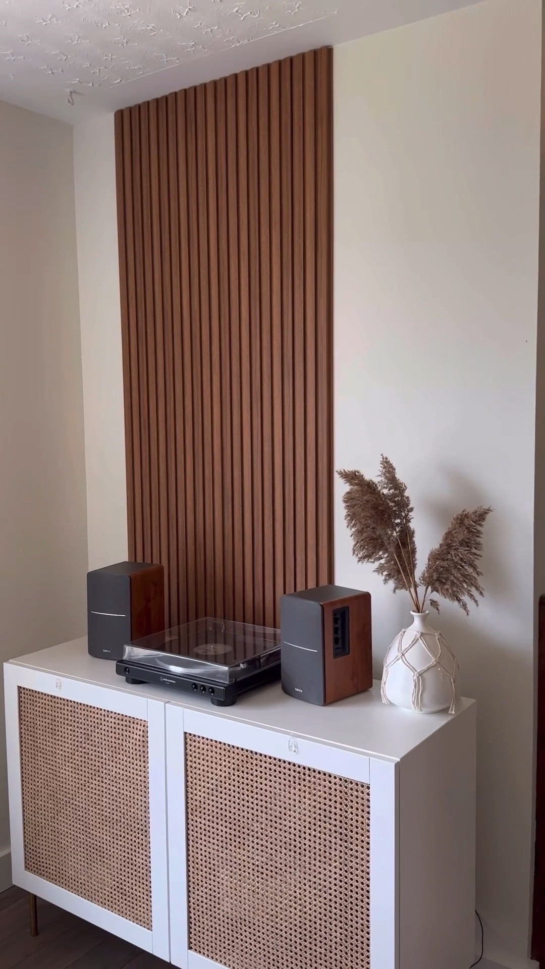 Wood Slat Paneling - Yay or nay? 

We were so undecided between doing the whole wall or just a section but the wall was really uneven in both the corner and the edge, we really loved the look of the small section with the floating shelf so we went with in that direction!

We are having the shelf custom made and built. Will share once officially done. 

This is such a beginner friendly DIY project. Having the panels makes it quick and easy to install. You could cut and stain your own for cheaper but for us, the pre-made was worth it. Costing $160 CAD for two packs. 

Next we will be replacing the railing and new light fixtures are on the way 🎉

#LTKhome #LTKVideo