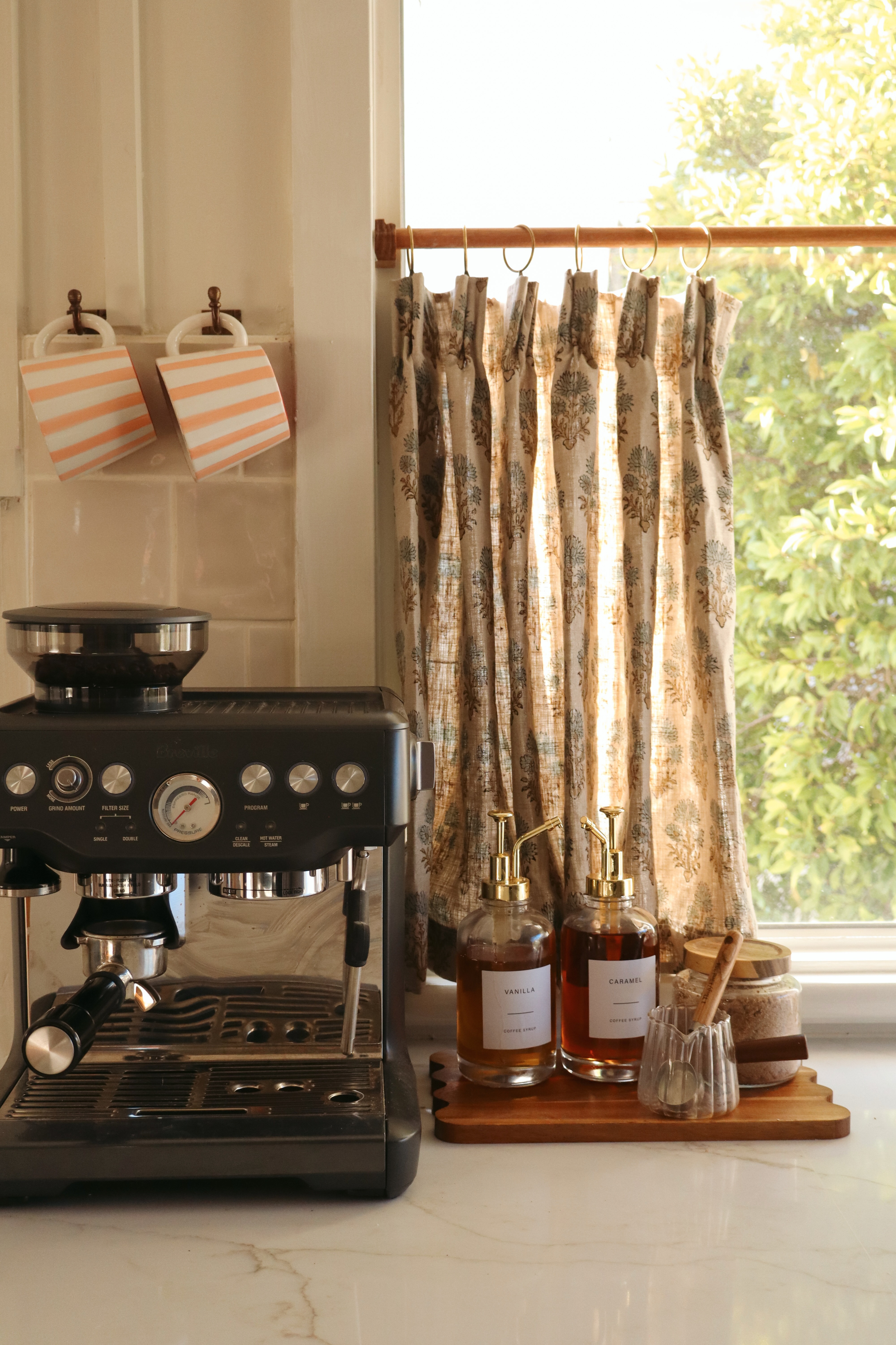 I made these cafe curtains a few months ago and now it's getting warmer I extra appreciate them! The fabric is so pretty and I'm still shocked I sewed them myself.  

 