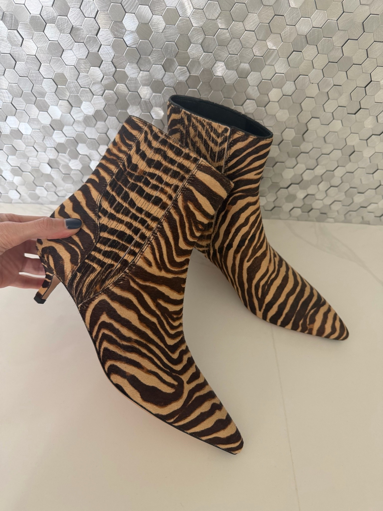 These zebra ankle booties are guaranteed to make any fall outfit more fabulous! The pointed toe and kitten heel feel sleek and feminine, while the animal print adds the perfect statement-making touch. #LTKShoeCrush 
 

 

#LTKSeasonal #LTKOver40