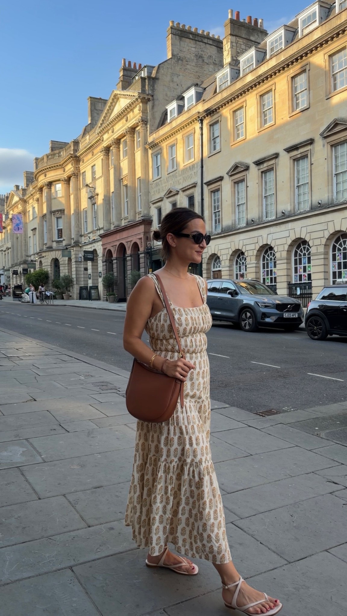 Europe in the summer calls for easy, versatile pieces that you can mix, match, and wear on repeat! This printed midi dress has been one of my favorite travel staples because it takes up hardly any room in my suitcase, works for everything from sightseeing to dinner, and pairs just as well with sandals as it does with a sweater on cooler evenings (runs small, size up if between sizes!). Finished the look with a simple brown crossbody and classic sandals for an outfit I’ll be recreating long after our trip!

#LTKSeasonal #LTKootd