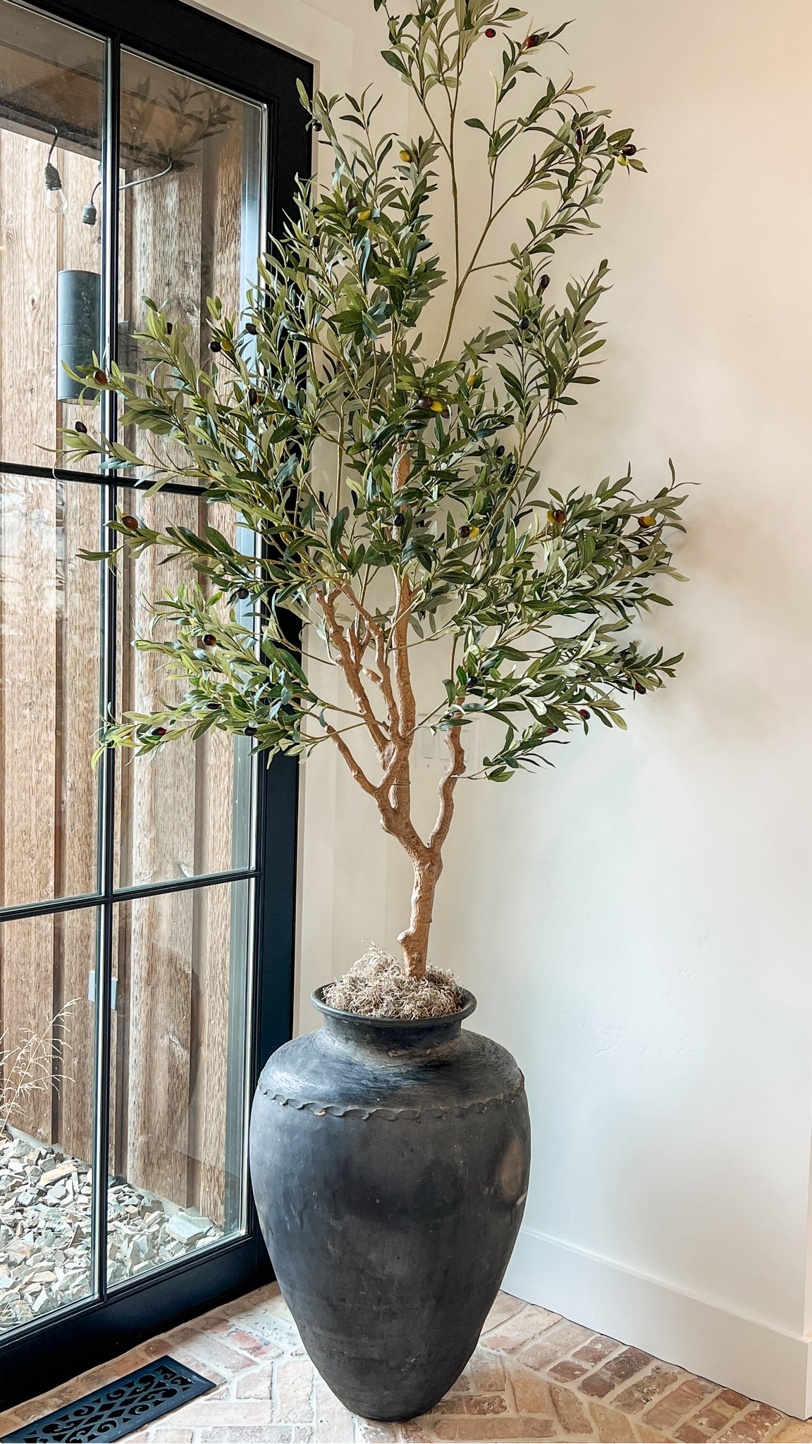 Olive tree in an antique pot in our foyer! I love these old european vibes!!

#LTKHome