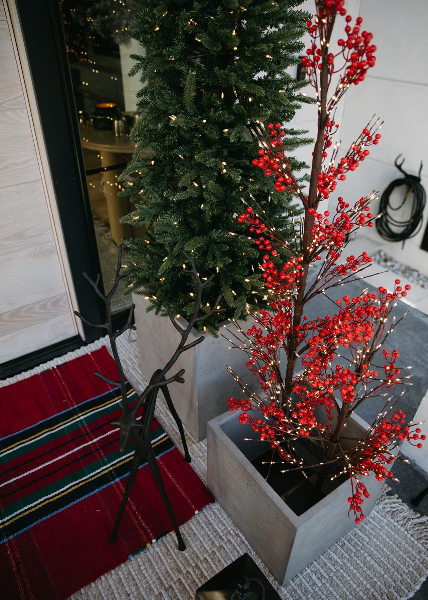 Can’t go wrong with a layered rug look. The Stewart Plaid is so cute for Christmas! Christmas front porch details linked below.