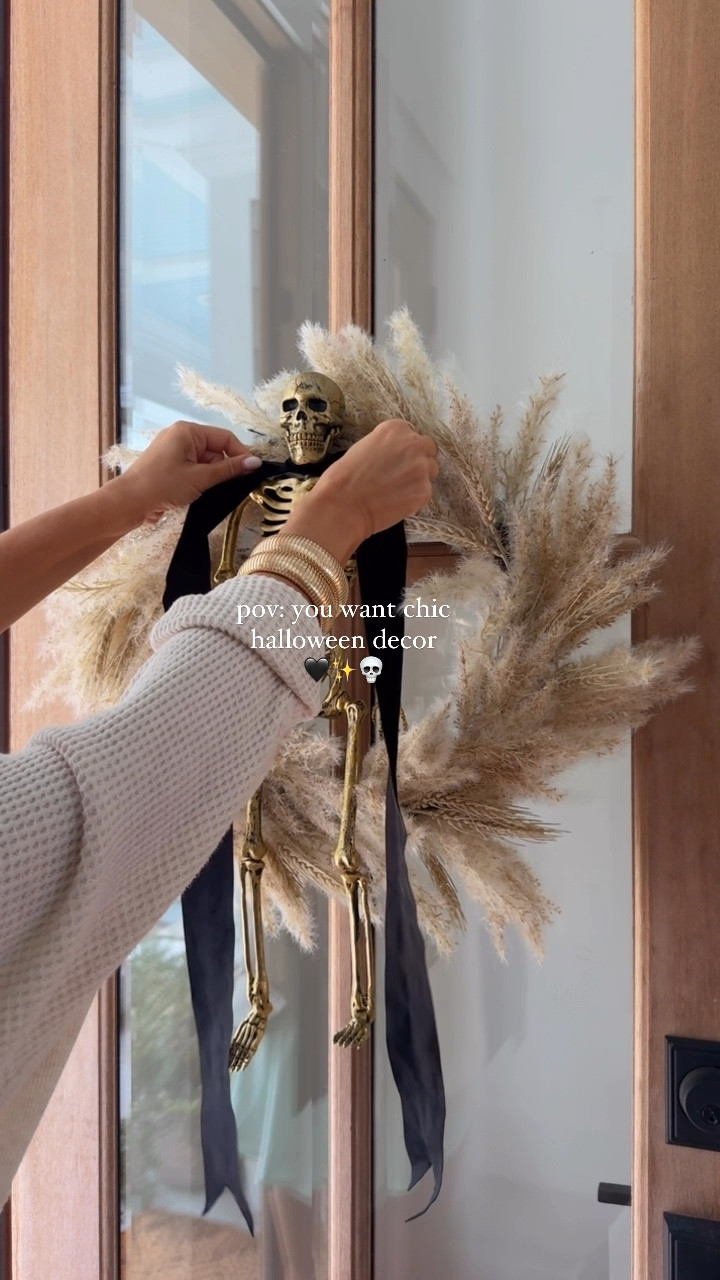 chic halloween loading…💀 | Mr. Skelly with a bow tie, I die! 🤭 this wreath is perfect on its own for fall but add a posable skeleton and some ribbon for a spooky cute touch for Halloween 🖤

share w/ a halloween lovin’ friend 👯‍♀️
#target #targetstyle #halloweendecor #spookyseason #spookycute #neutralhalloween #neutralhome #halloweendiy #halloweenwreath #bowseason 

#LTKSeasonal #LTKHome #LTKStyleTip