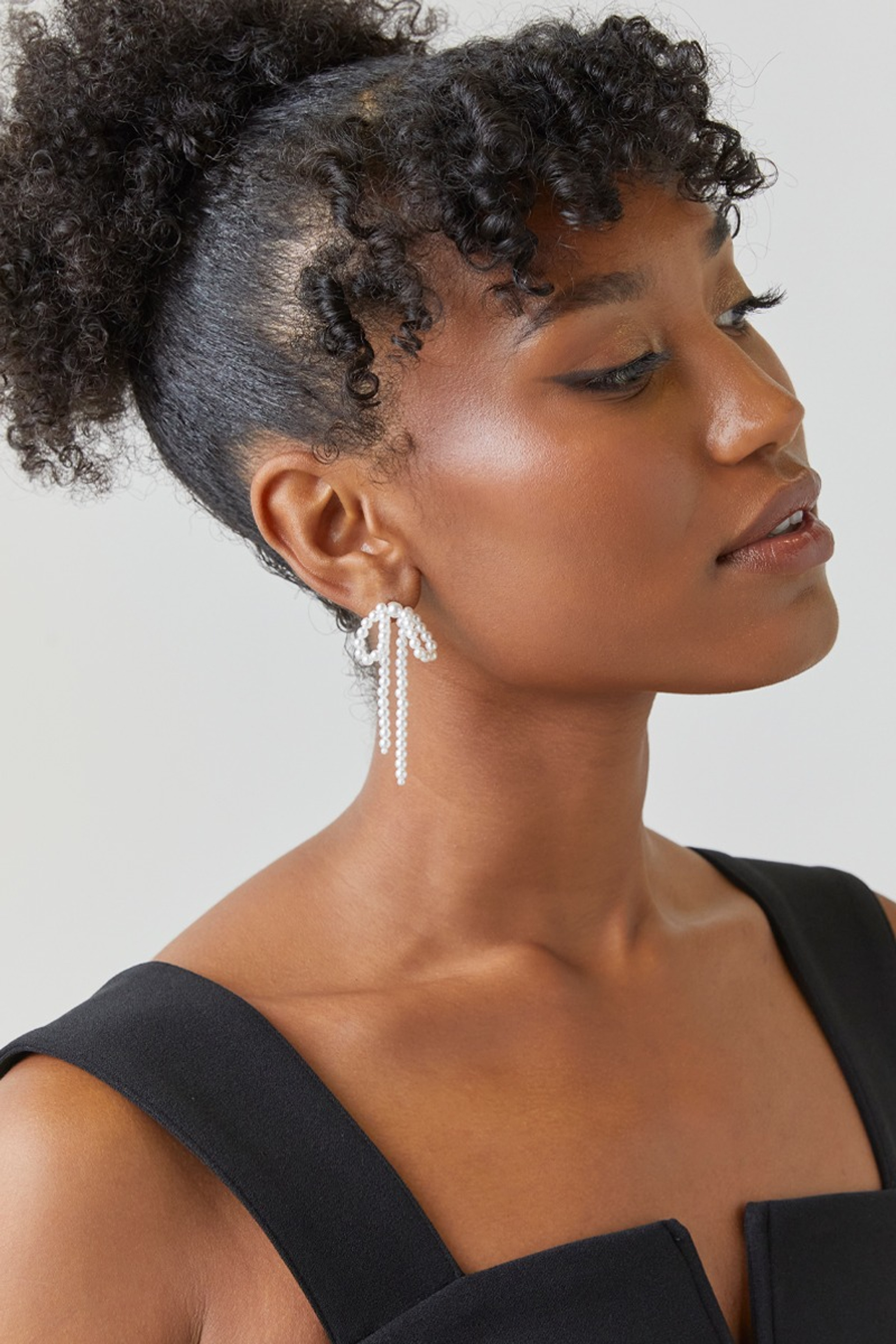 Abigail Pearl Strand Loose Bow Earrings | Francesca's