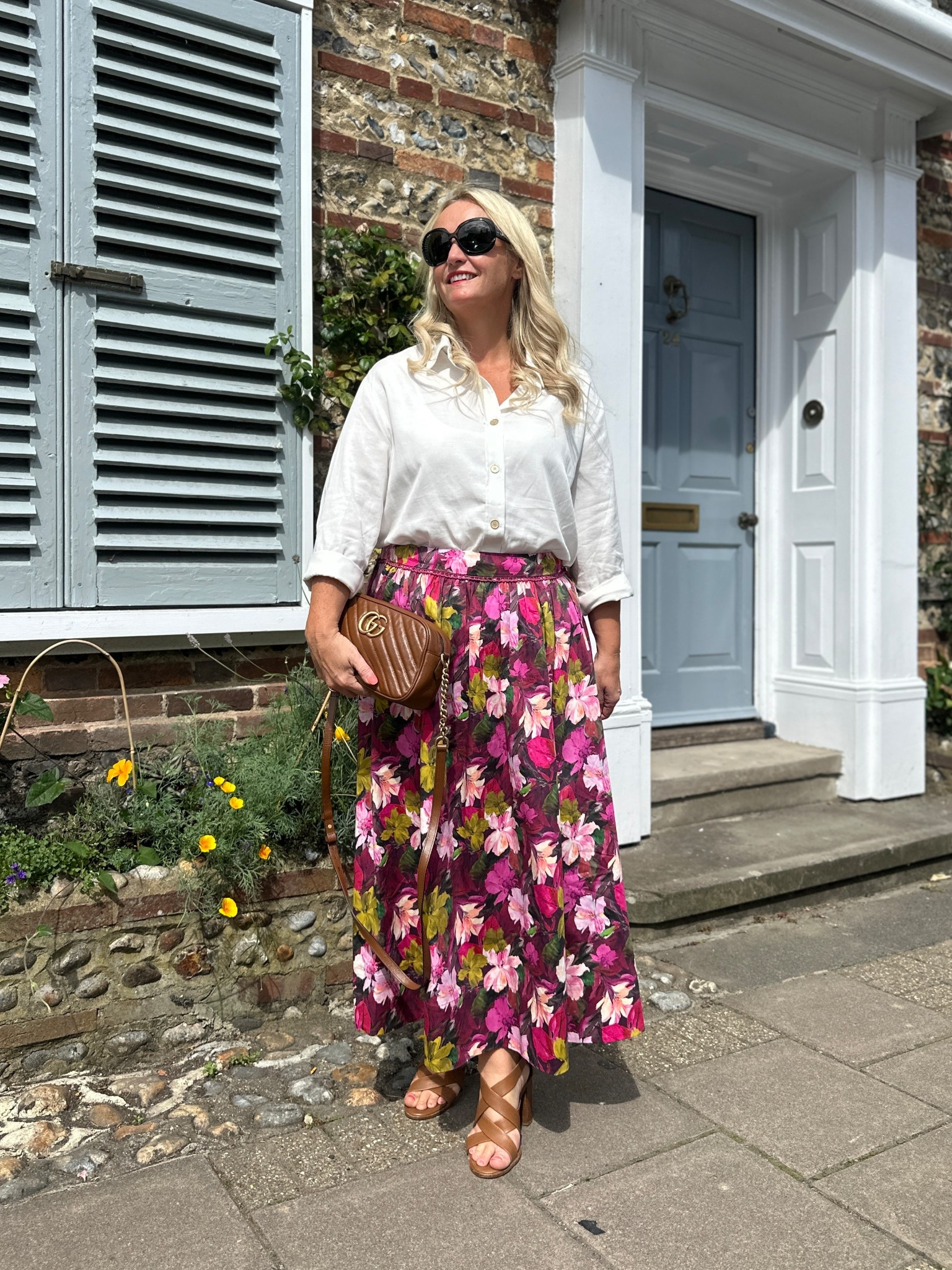 With no need for big coats and knitwear this week due to the warmer weather I’ve been enjoying wearing some lighter outfits again like this beautiful Arina floral skirt from @phaseeight. I’ve paired it here with a classic white shirt from @saintandsofia, tan sandals from @thewhitecompany and @gucci bag. 

#LTKuk #LTKmidsize #LTKautumn