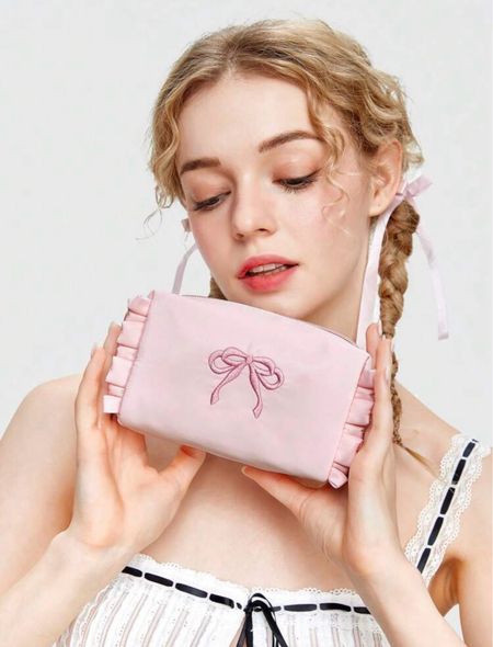 This is the cutest mini cosmetic bag you could put your lipsticks in it or whatever you like and throw it in your handbag for on the go! #shein #pink #cosmeticbag #bow #ribbon #ruffles #makeupbag

#LTKFindsUnder50 #LTKBeauty #LTKTravel