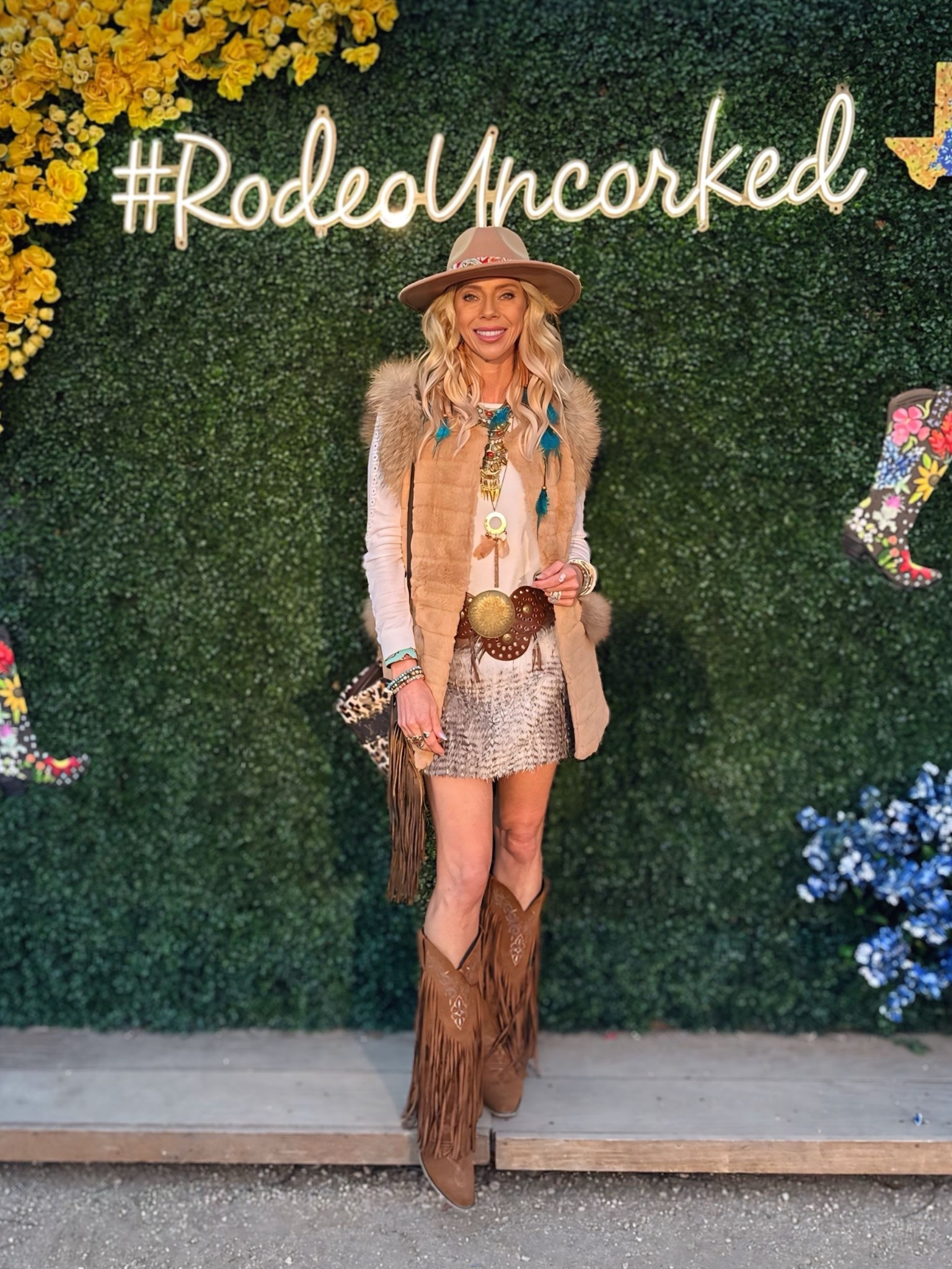 Rodeo, festival and country music concert chic. Cowgirl looks. Western attire. Fur, feathers, fringe and leather. Rabbit fur vest and fur skirt, fringe boots and cowboy hat. Carnival glam

#LTKSpringSale #LTKParties #LTKShoeCrush