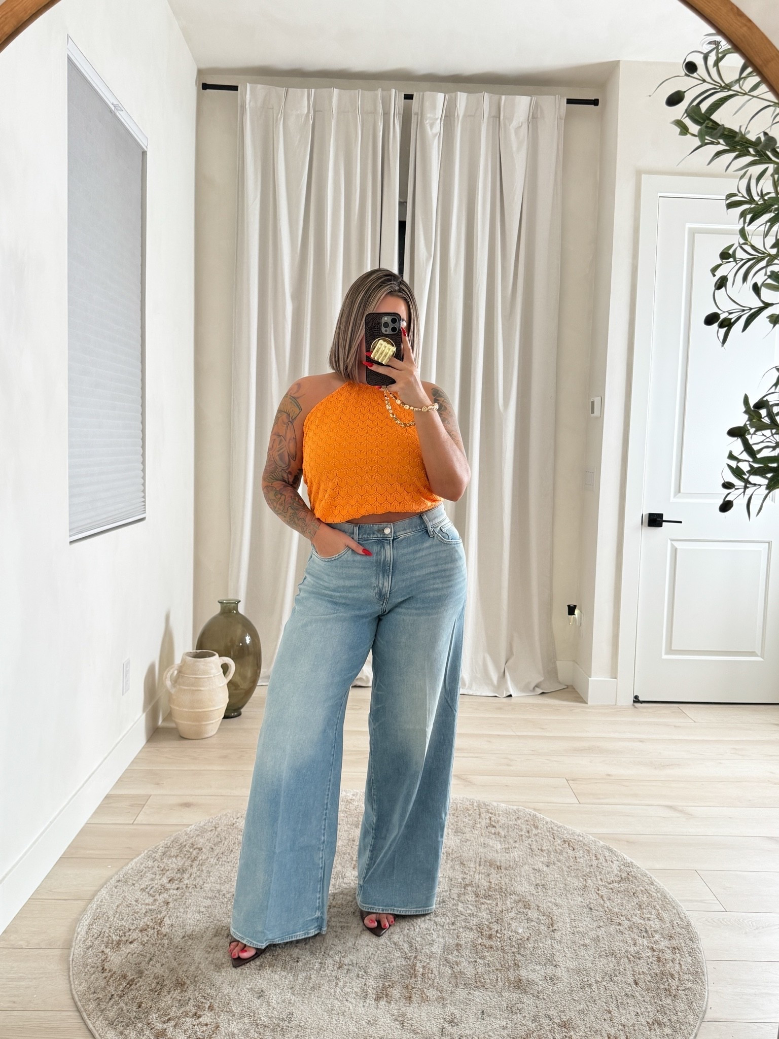 Jeans 12L they are a little big in the waist and crotch area I probably could have sized down. If between sizes size down. Jeans are a very soft flexible denim and have some stretch as well 
Top L but I would also size down to a M it’s really big I have it tied up in the back to give the fit I wanted.
