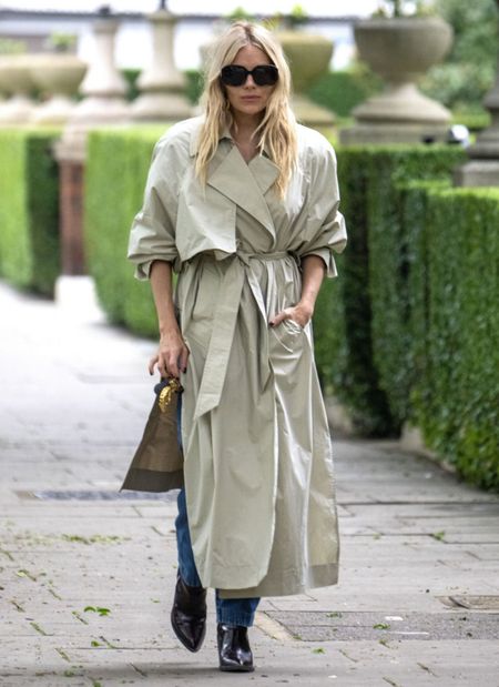 Shop Sienna Miller's 100% cotton long trench coat, straight design lapel notch long sleeve, oversize sunglasses, point to patent leather boots #SiennaMiller #CelebrityStyle