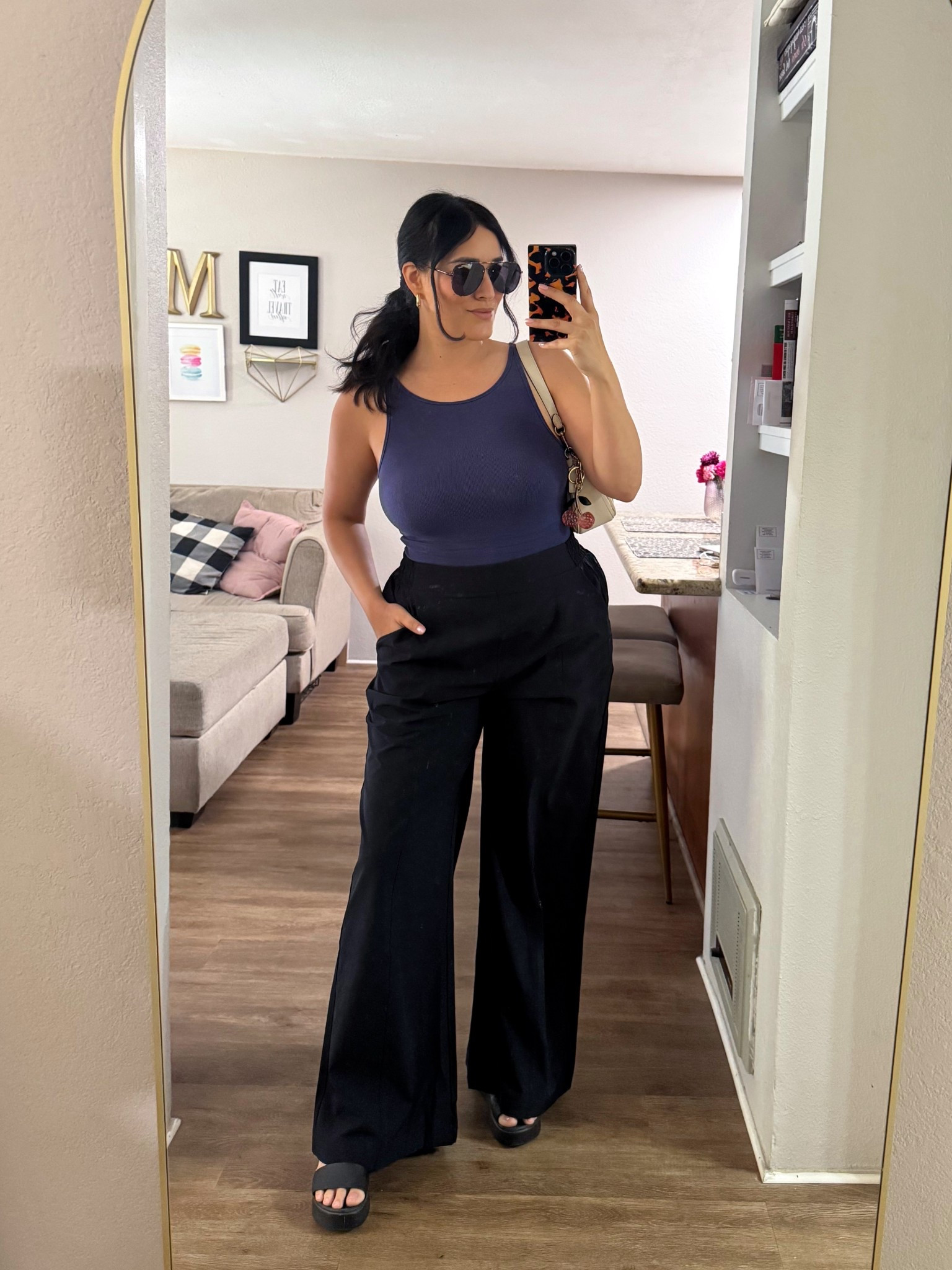 Navy fitted tank from with black wide leg trousers from @Fabletics for an easy elevated everyday outfit. Simple, flattering, and perfect for casual days when you still want to look put together 🖤

Tank // M
Pants // L
Sandals // 8

#LTKootd