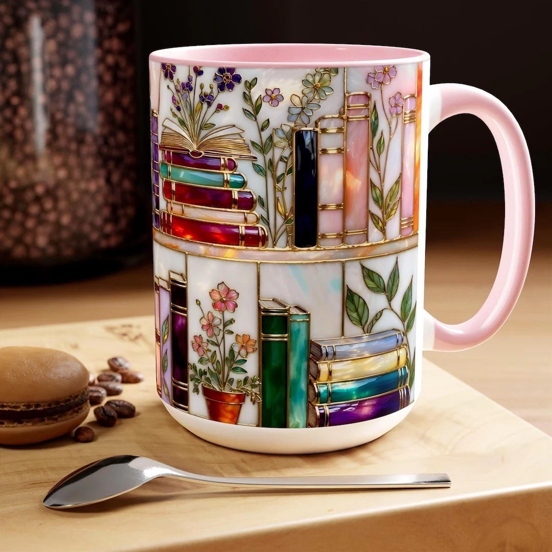 Elevate every sip with this enchanting stained-glass style bookshelf mug, crafted in ceramic and adorned with jewel-tone books, glowing pages, and soft floral accents. Its dreamy, luminous artwork brings a cozy, bookish vibe to your mornings, making it a perfect companion for long reading sessions or a thoughtful gift for teachers, librarians, writers, and avid readers alike. Available in both 11oz and 15oz sizes, each mug is professionally sublimated for a vibrant, long-lasting finish that won’t fade. A beautiful, uplifting piece for anyone who loves storytelling and art with a magical touch. #BookLoverGift #LibraryAesthetic #CozyReads #StainedGlassArt #EtsyFinds #TeacherGift #BookishMug

#LTKGiftGuide #LTKHoliday #LTKdayinmylife