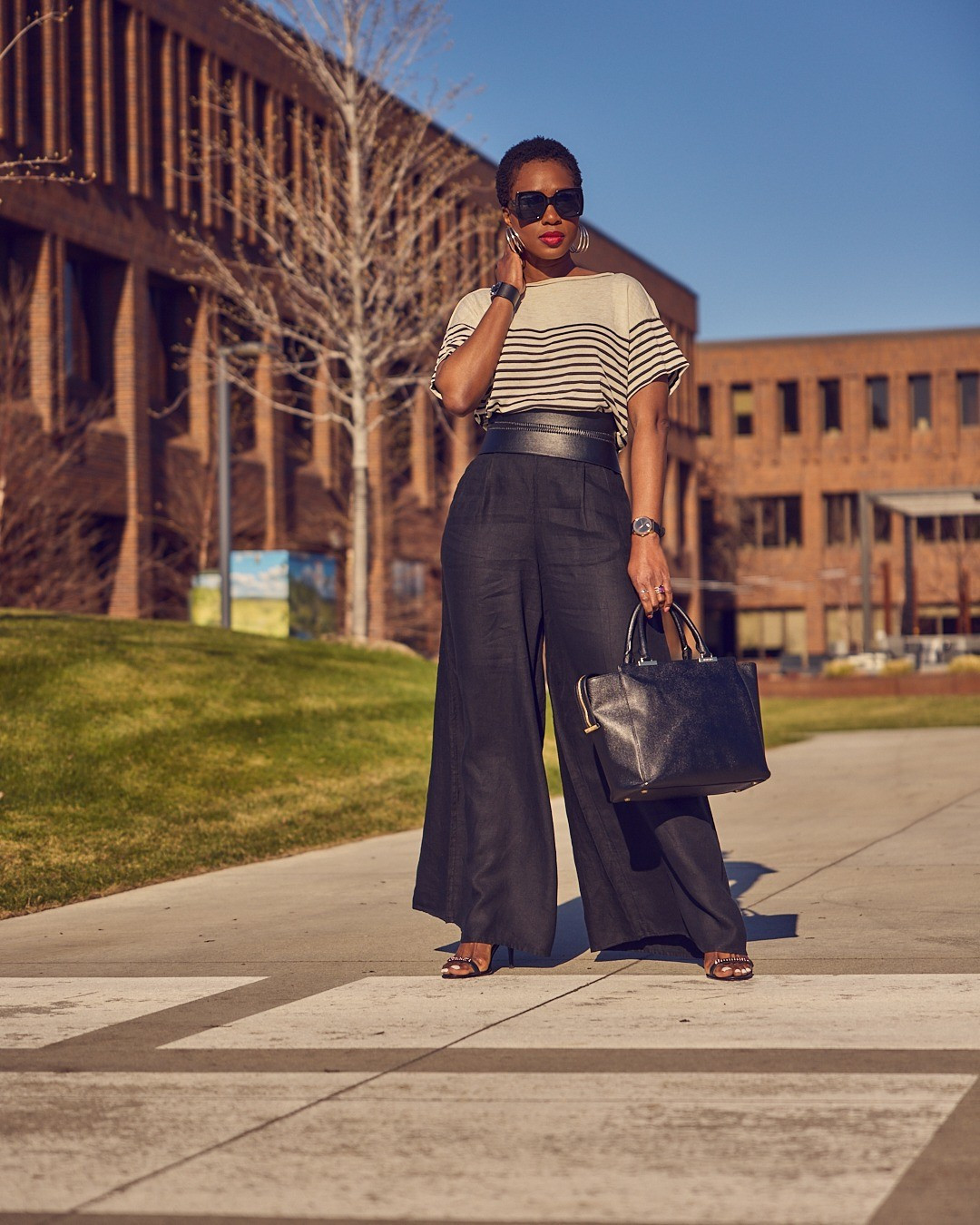 An easy business casual outfit with black wide leg pants and a striped tee. I sized down on the pants and am wearing a 6T vs. my regular 8T. The top fits true to size and is under $30!Nordstrom, Banana Republic, BCBG, Amazon, Jennifer Zeuner, workwear, tall-friendly pants, strappy sandals

