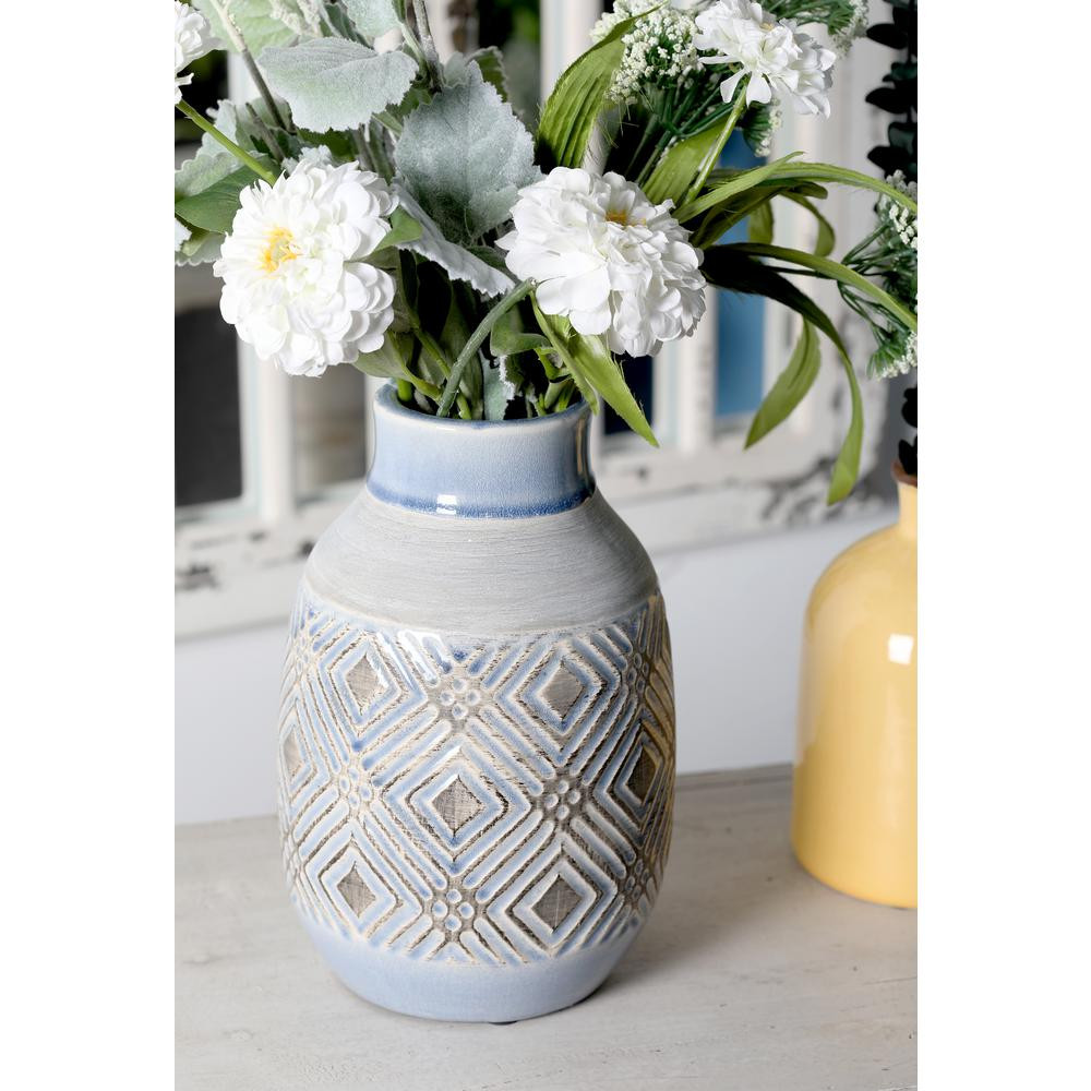 Litton Lane 11 in. White Ceramic Decorative Vase with Blue Spouted Mouth and Geometric Weave Pattern | The Home Depot