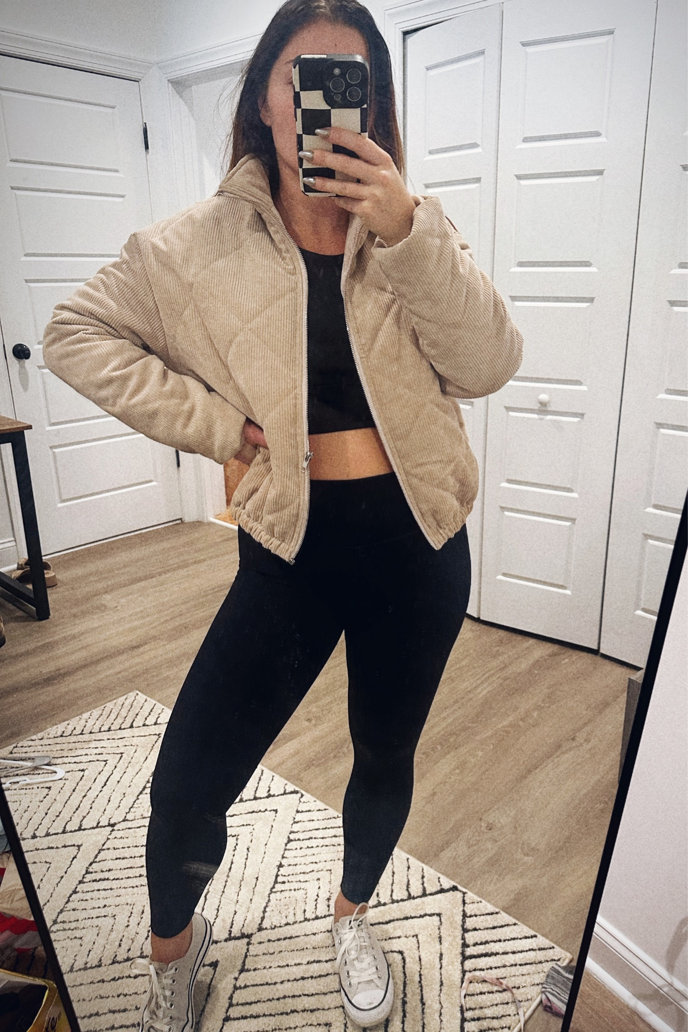 Black leggings, black top, and beige puffer jacket with converse 

#LTKfindsunder50 #LTKstyletip #LTKSeasonal